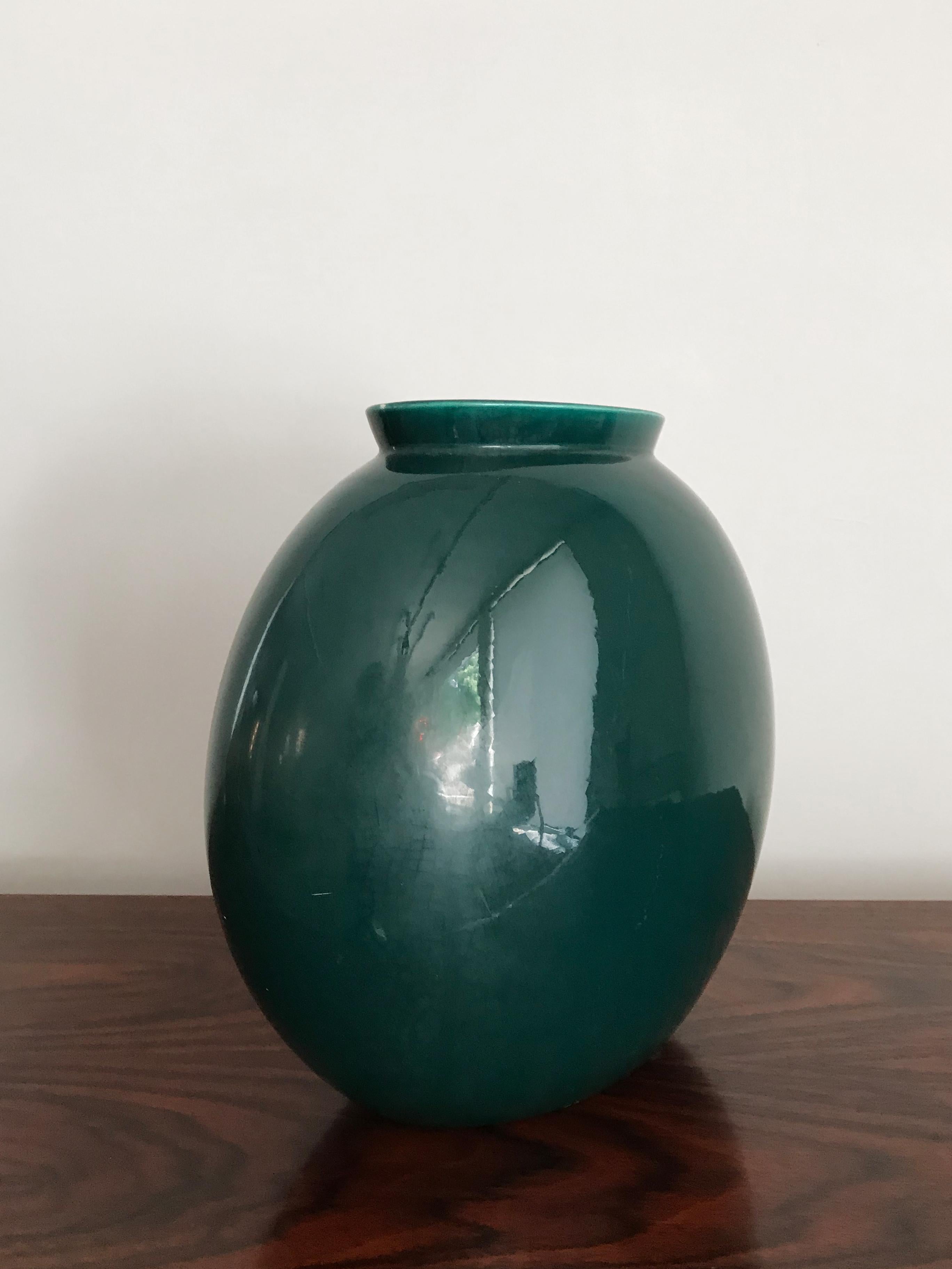 Italian Mid-Century Modern design ceramic vase model “1316/4” designed by Guido Andloviz and produced by S.C.I. (Società Ceramica Italiana, Laveno) with green semi-gloss enamel, 1950s
Marked “Lavenia 9-51” and with the graphic symbol of the