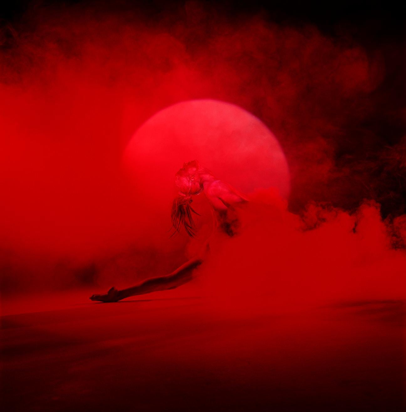 Giulia and Red Smoke - nude photograph of female model with red background