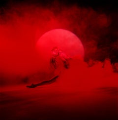 Giulia and Red Smoke - nude photograph of female model with red background