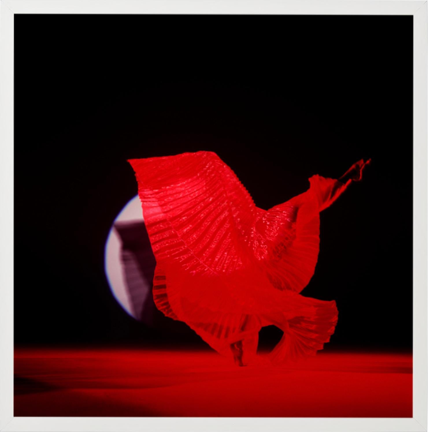 Giulia With Red Wings - nude photograph of female model with red background - Black Nude Photograph by Guido Argentini