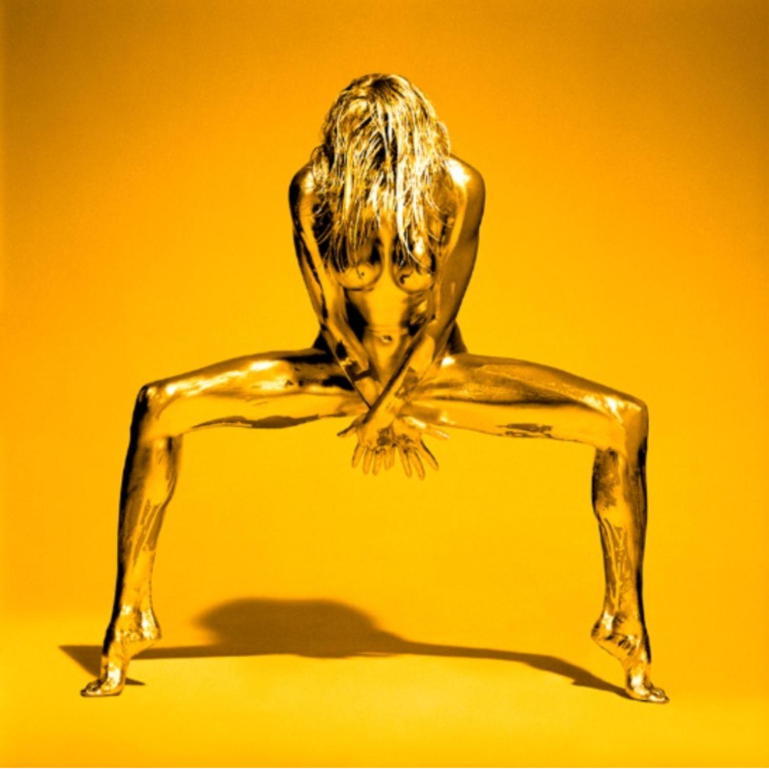 Golden Eye - naked woman covered with gold