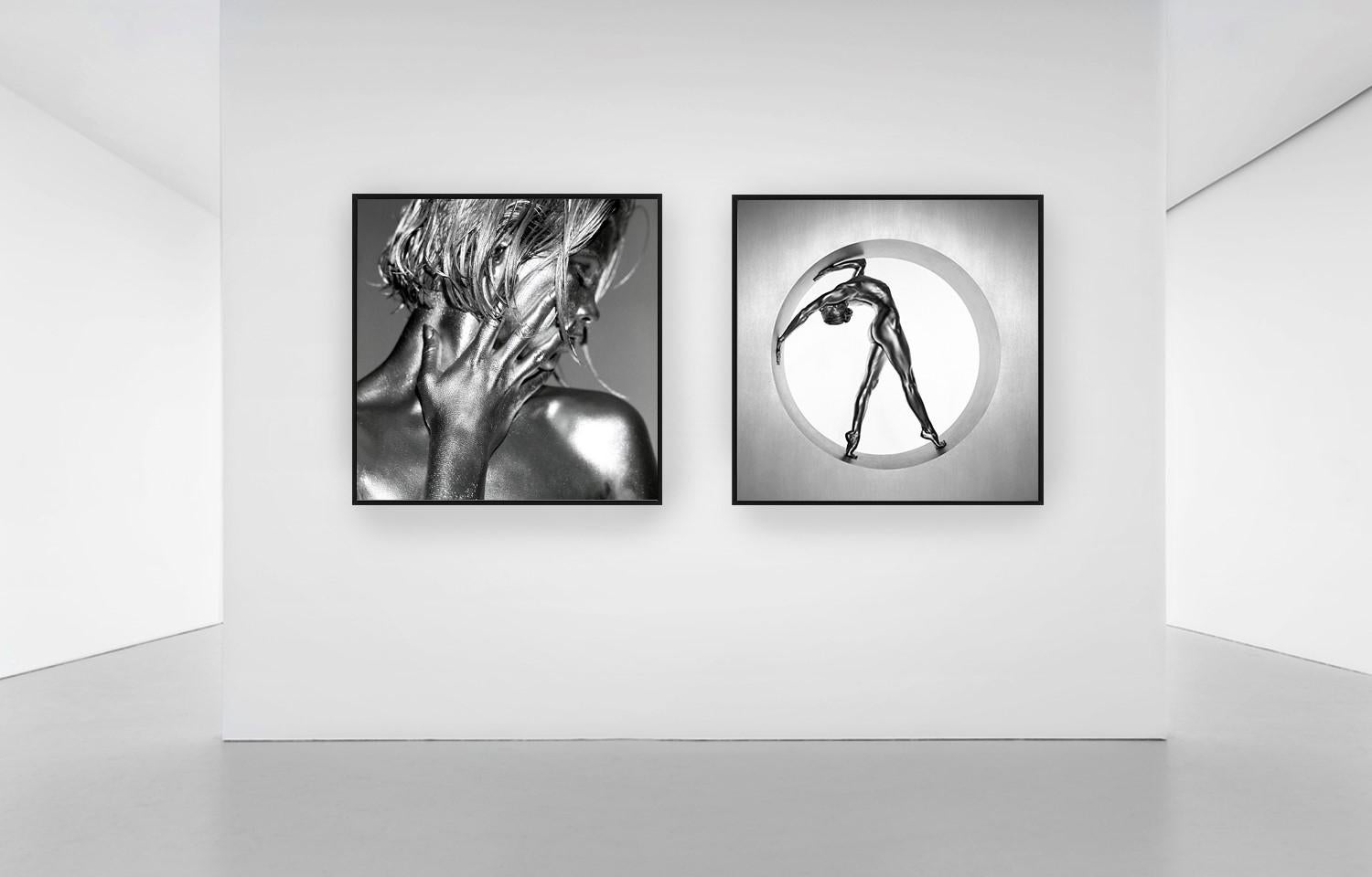 Heimarmene - A female dancer bending, painted silver, fine art photography, 1995 - Contemporary Photograph by Guido Argentini