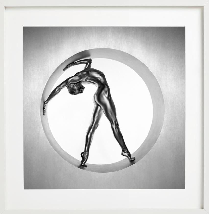 Heimarmene - A female dancer bending, painted silver, fine art photography, 1995 - Gray Color Photograph by Guido Argentini