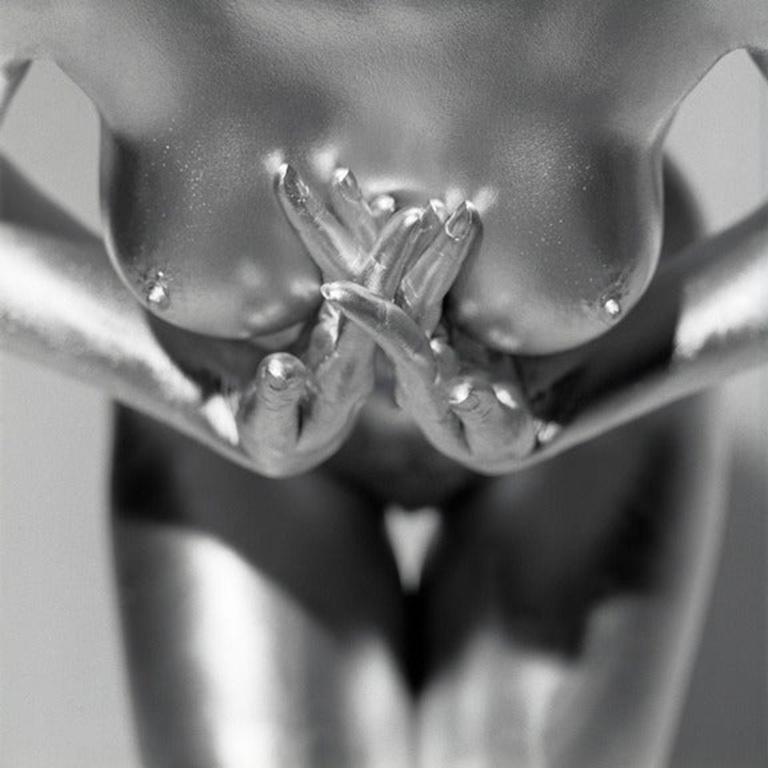 Nude female torso of a woman painted in silver. Other sizes on request. Guido Argentini is one of the most illustrious photographers in the world. He is a master of erotic photography, and his sculpturesque representations of the female form create