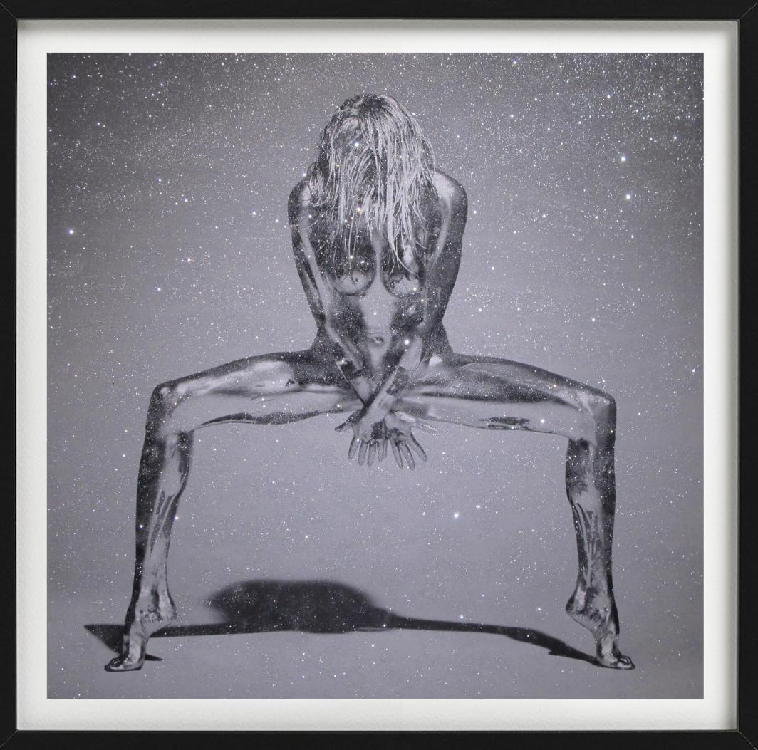 Nude Model in acrobatic pose covered in metallic silver paint, photographed by Guido Argentini in 1995.

All prints are limited edition. Available in multiple sizes. High-end framing on request.

All prints are done and signed by the artist. The