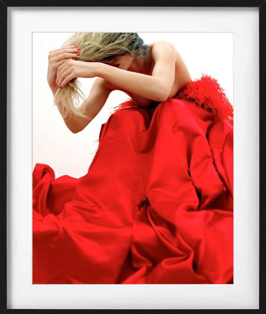 Stand Outside Yourself - woman in red dress bending over, fine art photography - Red Color Photograph by Guido Argentini