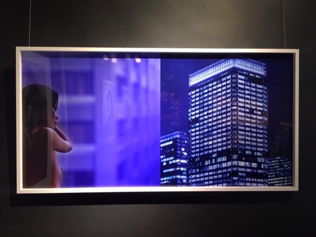 Thoughts across the sky - diptych of a nude model and skyscrapers in blue shades - Photograph by Guido Argentini