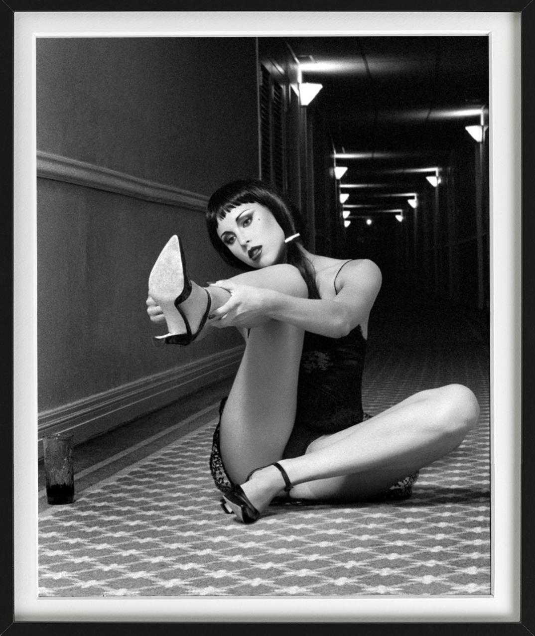 'Tove playing with her shoe' - cinematic b&w portrait, fine art photography 1995 - Photograph by Guido Argentini