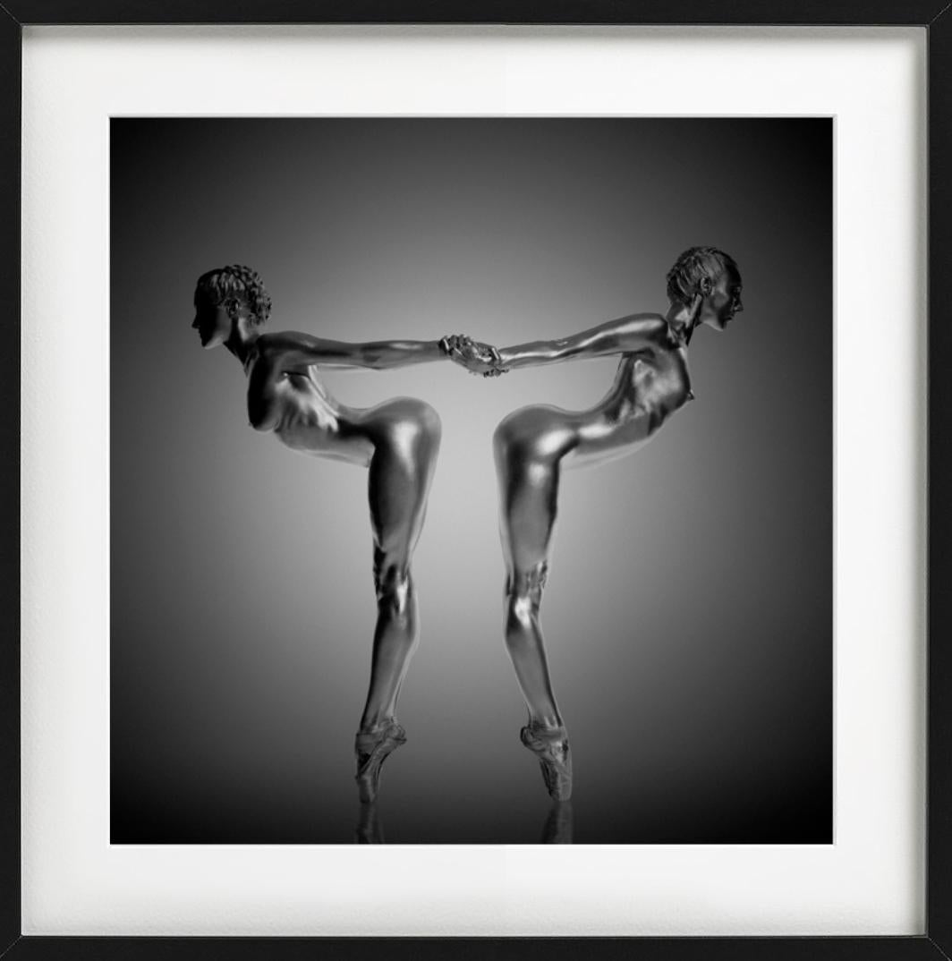 Unity - two silver-painted models in sculptural pose, fine art photography, 2009 - Photograph by Guido Argentini