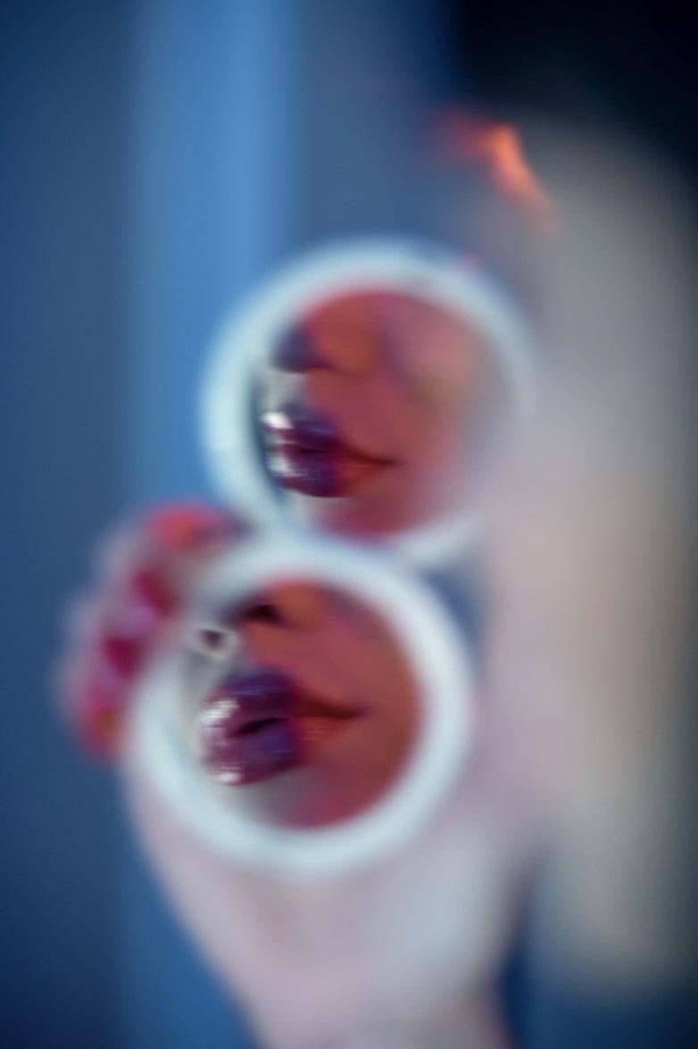 Guido Argentini Figurative Photograph - Untitled #130 - red lips reflected in a pocket mirror, fine art photography 2024