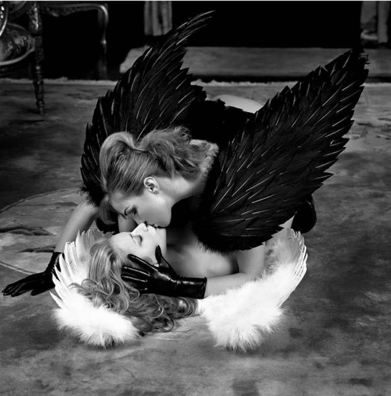 Guido Argentini Portrait Print - Love simply is - two woman in angel wings lying on floor and kissing
