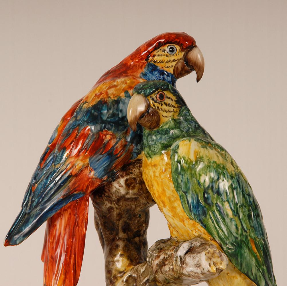 Guido Cacciapuoti Italian Art Deco large ceramic animal figurine 
Depiction: Two parrots on a tree trunk
Hand crafted and hand painted in strong bold colors
Italian design sculpture collectors item from the Art deco period
Mark: signed Cacciapuoti (