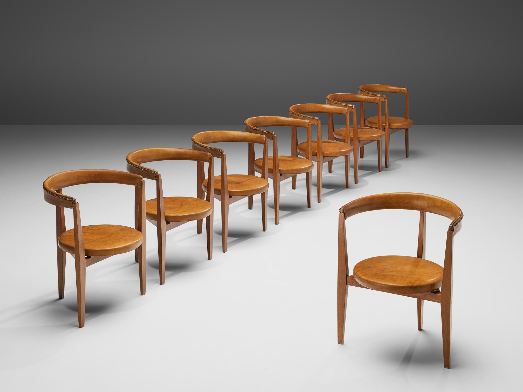 Guido Canali, set of eight dining chairs, walnut, leather, brass, Italy, 1960s

This set is one of the rare furniture designs by the architect Guido Canali (born 1935). The chairs, designed by Canali at the early stages of his career, were inspired