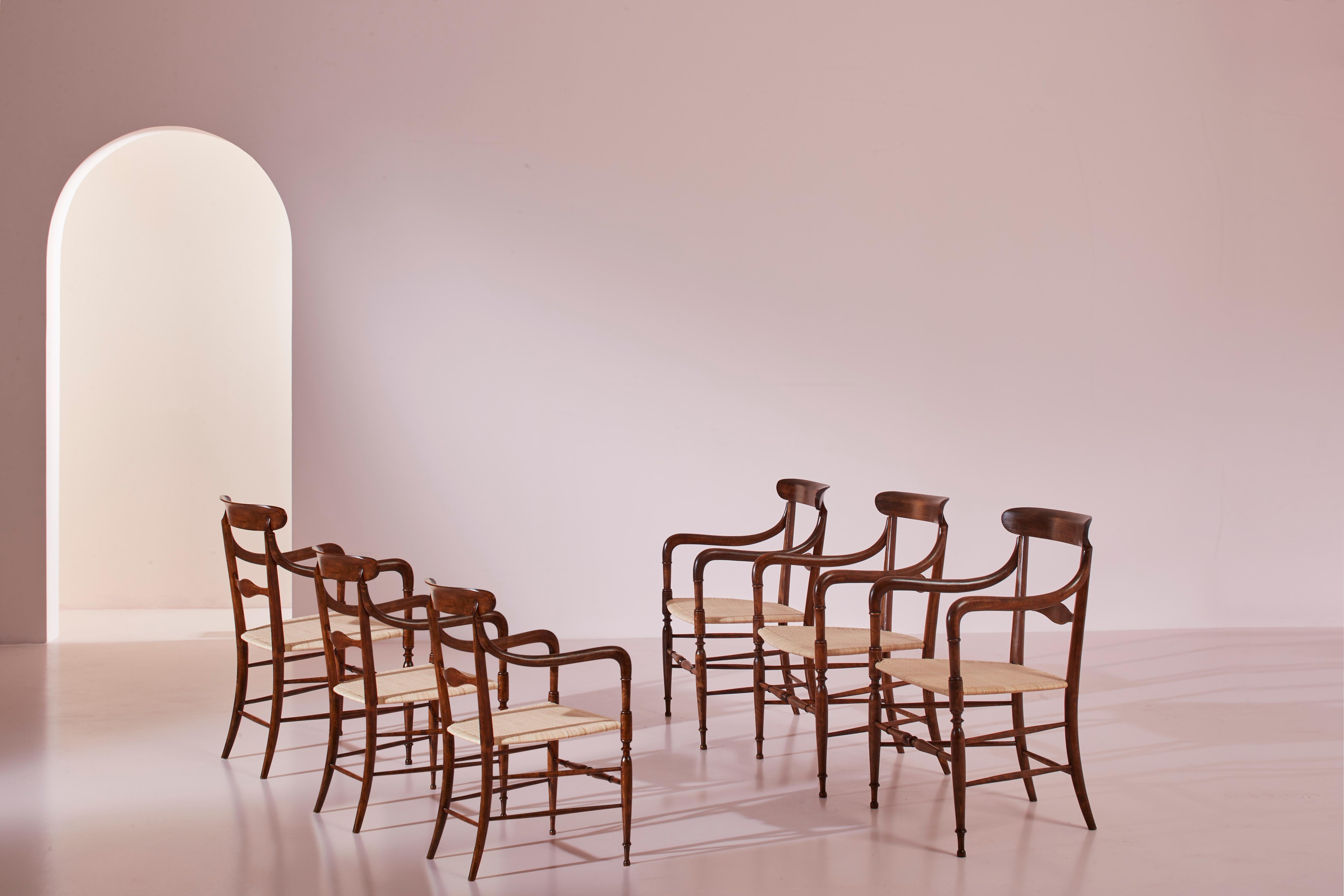 A rare and spectacular collection comprising six meticulously restored and newly caned armchairs, identified as the 