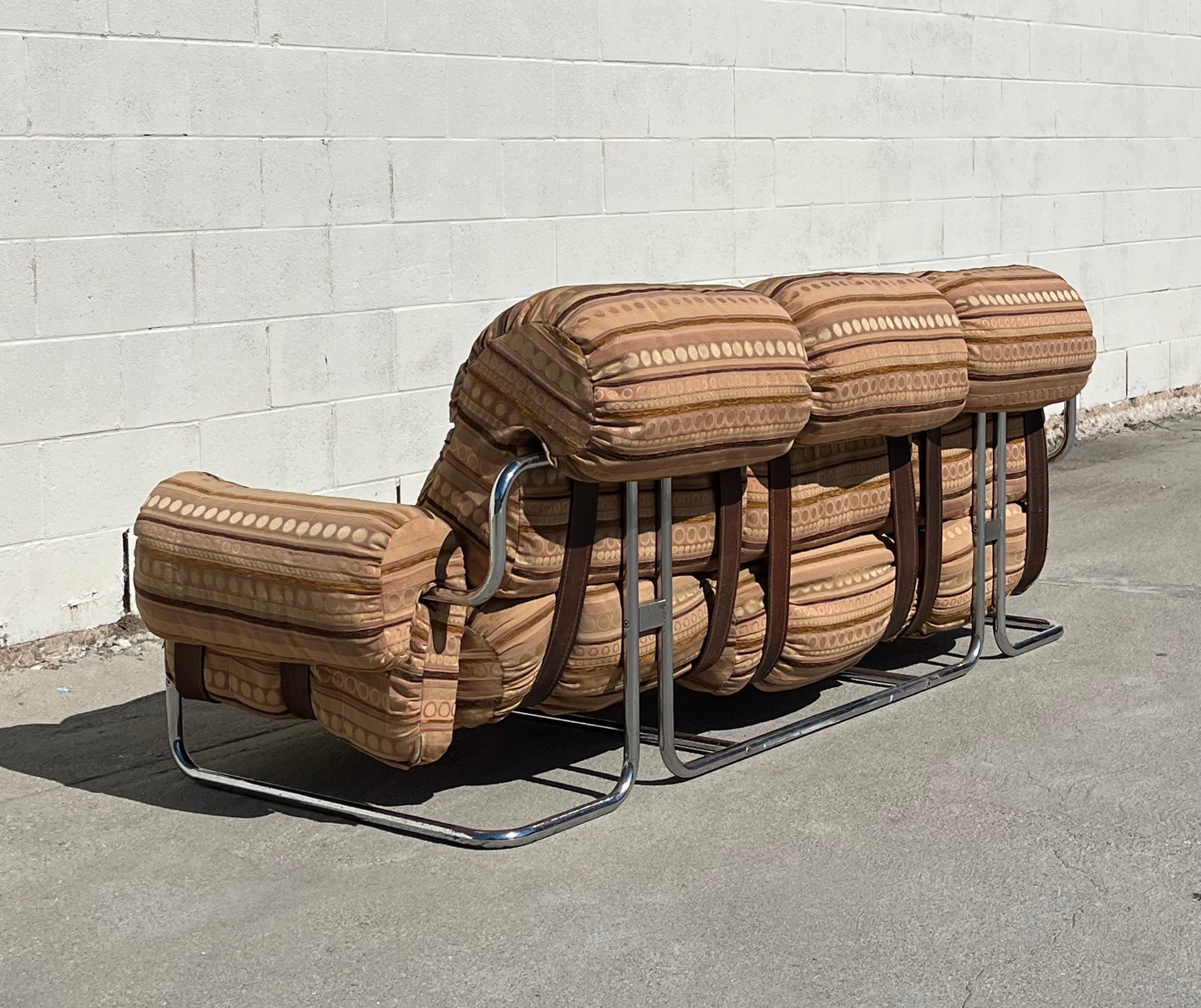 Vintage 1970's 'Tucroma 3-seat sofa designed for i4Mariani by Guido Faleschini. Features tubular chrome frame with thick brown leather support straps. Appears to have been reupholstered several years ago. Fabric is in immaculate condition.