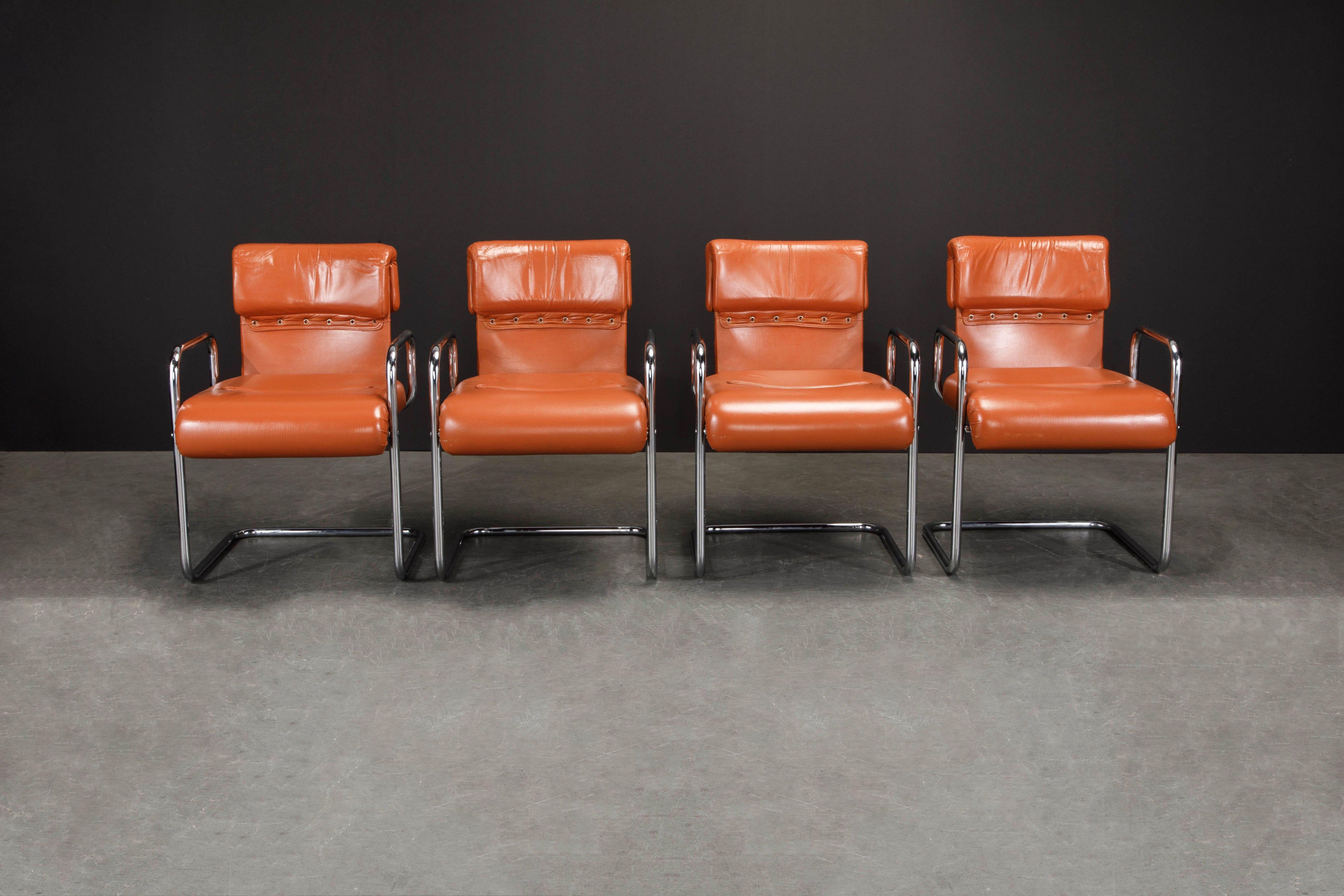 An incredible set of four (4) cognac leather armchairs by Guido Faleschini for i4Mariani, retailed in the United States by The Pace Collection. The seats and backs retain the original supple deep cognac colored leather upholstery and are attached to