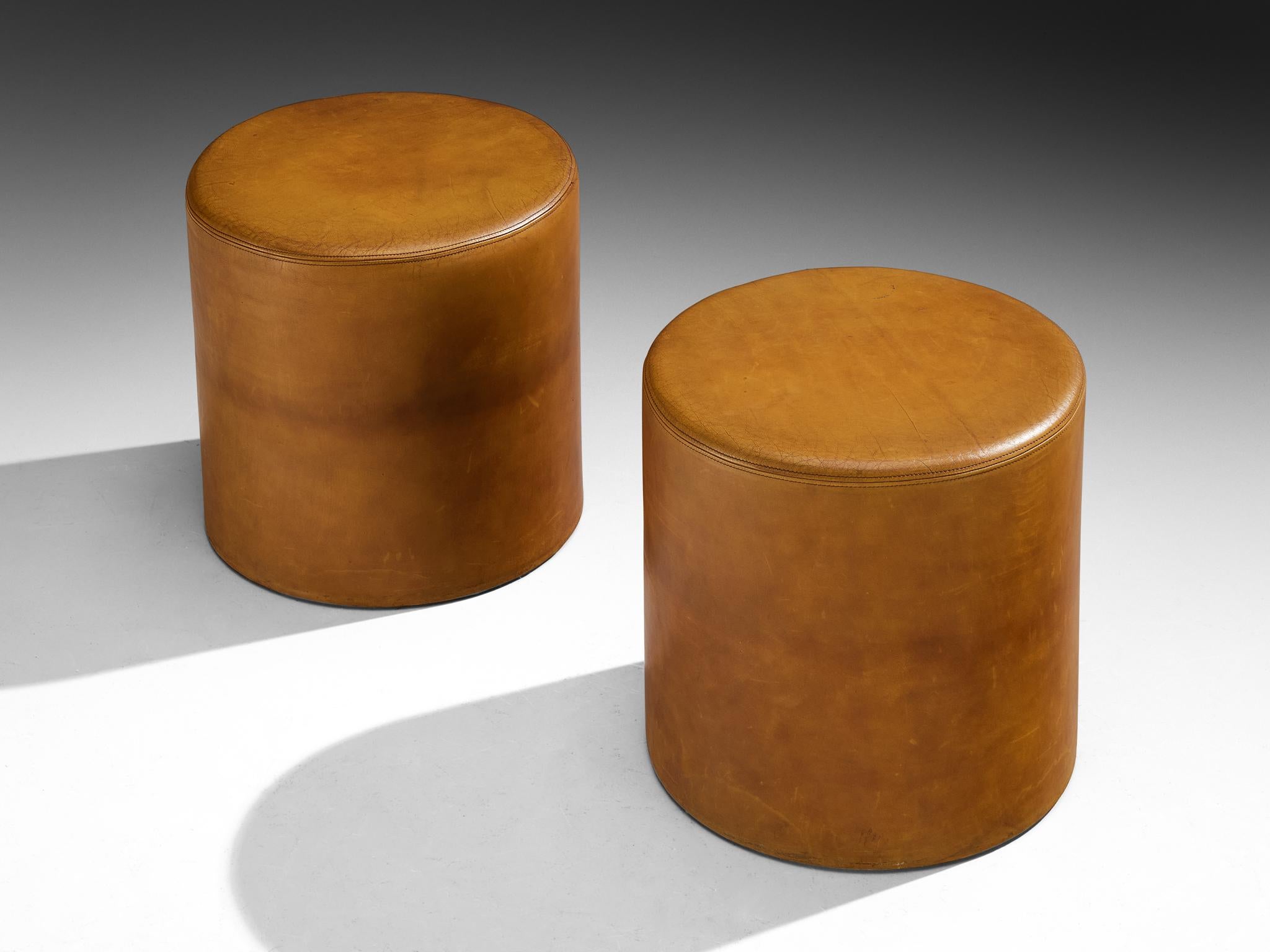 Guido Faleschini for i4 Mariani, pair of stools from the ‘Pace Collection’, leather, Italy, circa 1975 

Designed by Guido Faleschini for the Pace Collection, this pair of cylinder stools has a clear and direct form. The straight sides rise to a