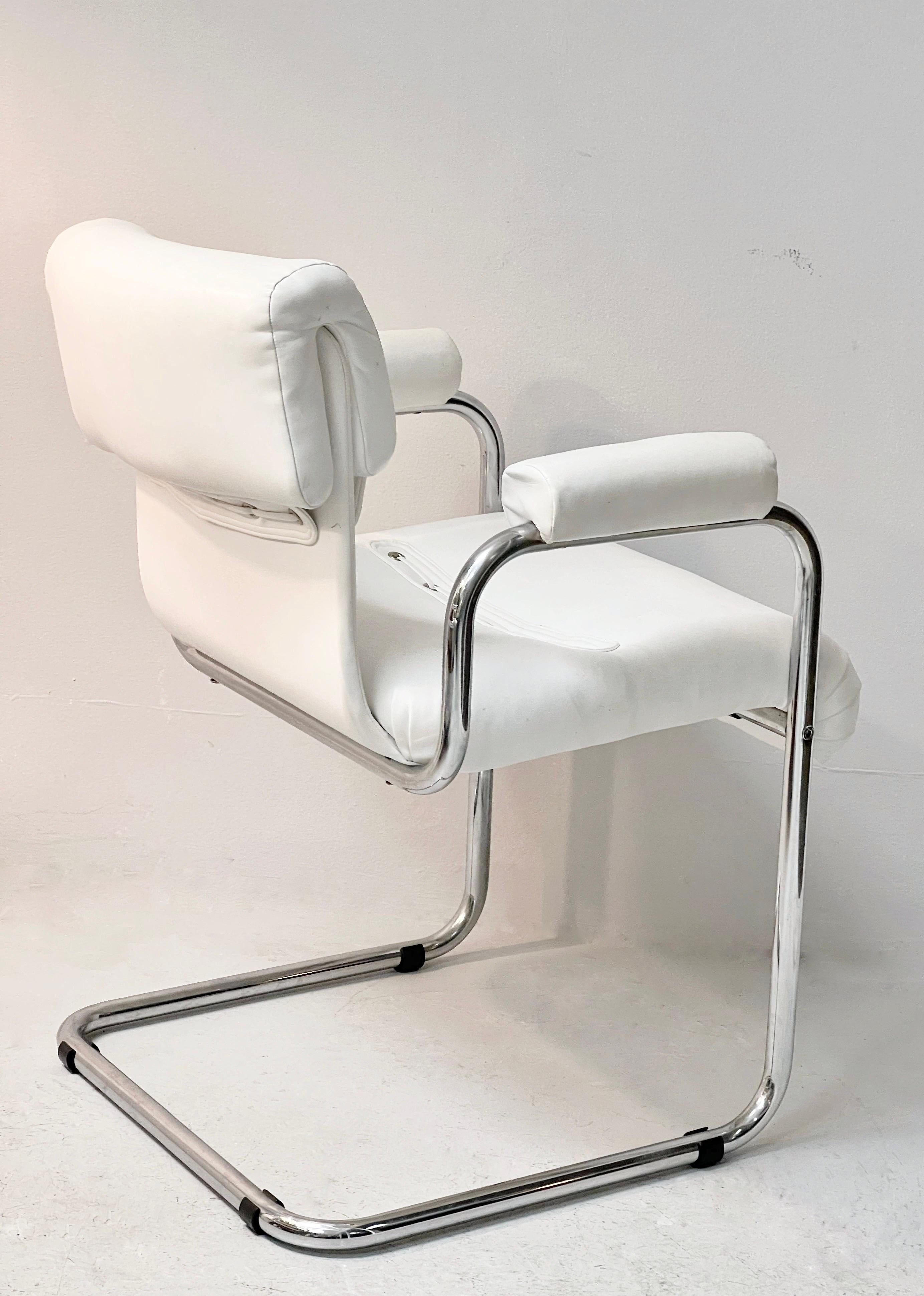 Great looking chairs by Guido Faleschini. A rare find in the original white leather upholstery. Versatile chairs that can be used in any room. 2 available.