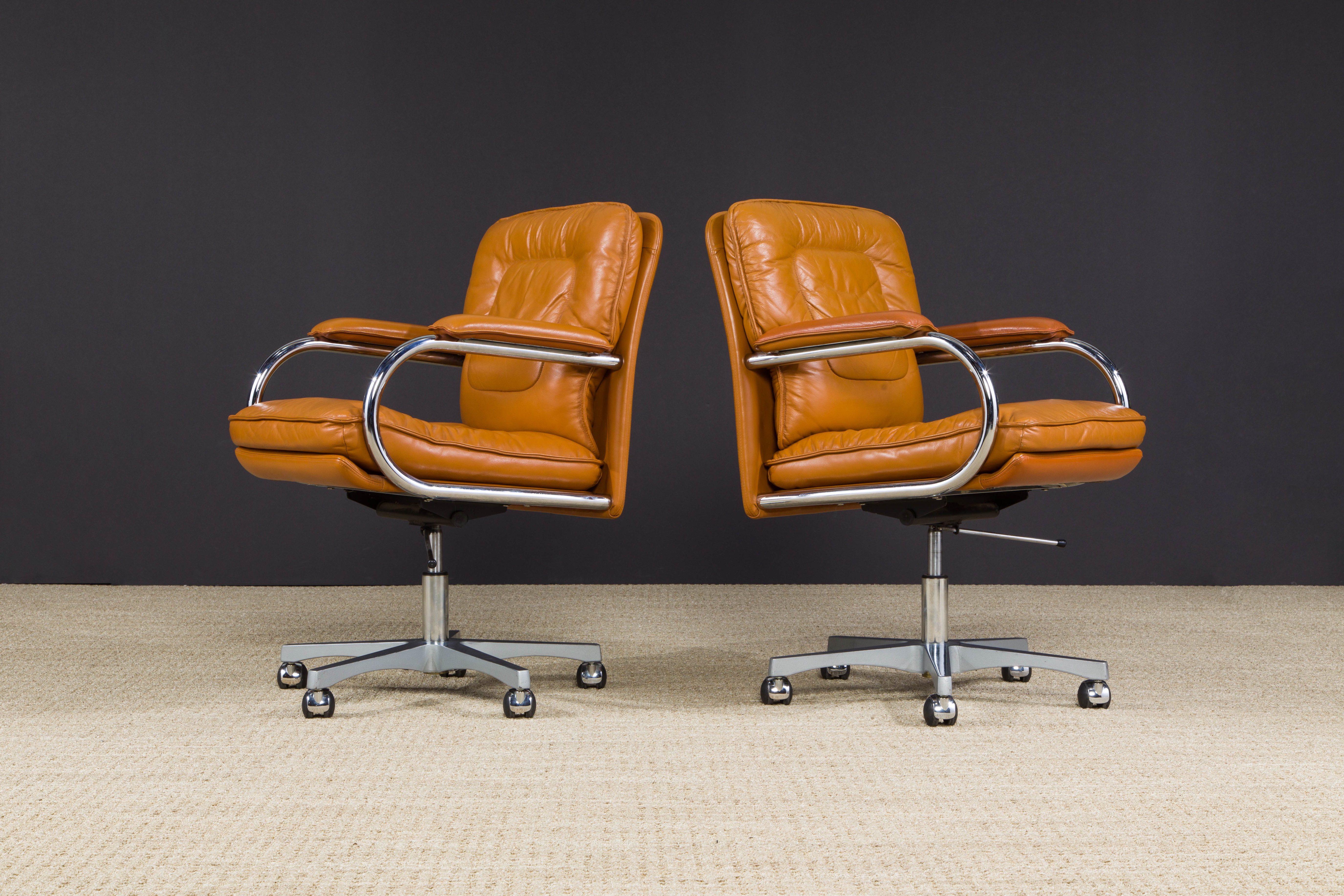 These elegant and no longer produced (making them great for collectors) Guido Faleschini swivel desk chairs by luxury Italian maker i4 Mariani were retailed in the 1980s by Pace and feature very-comfortable double cushioned seats and backs which