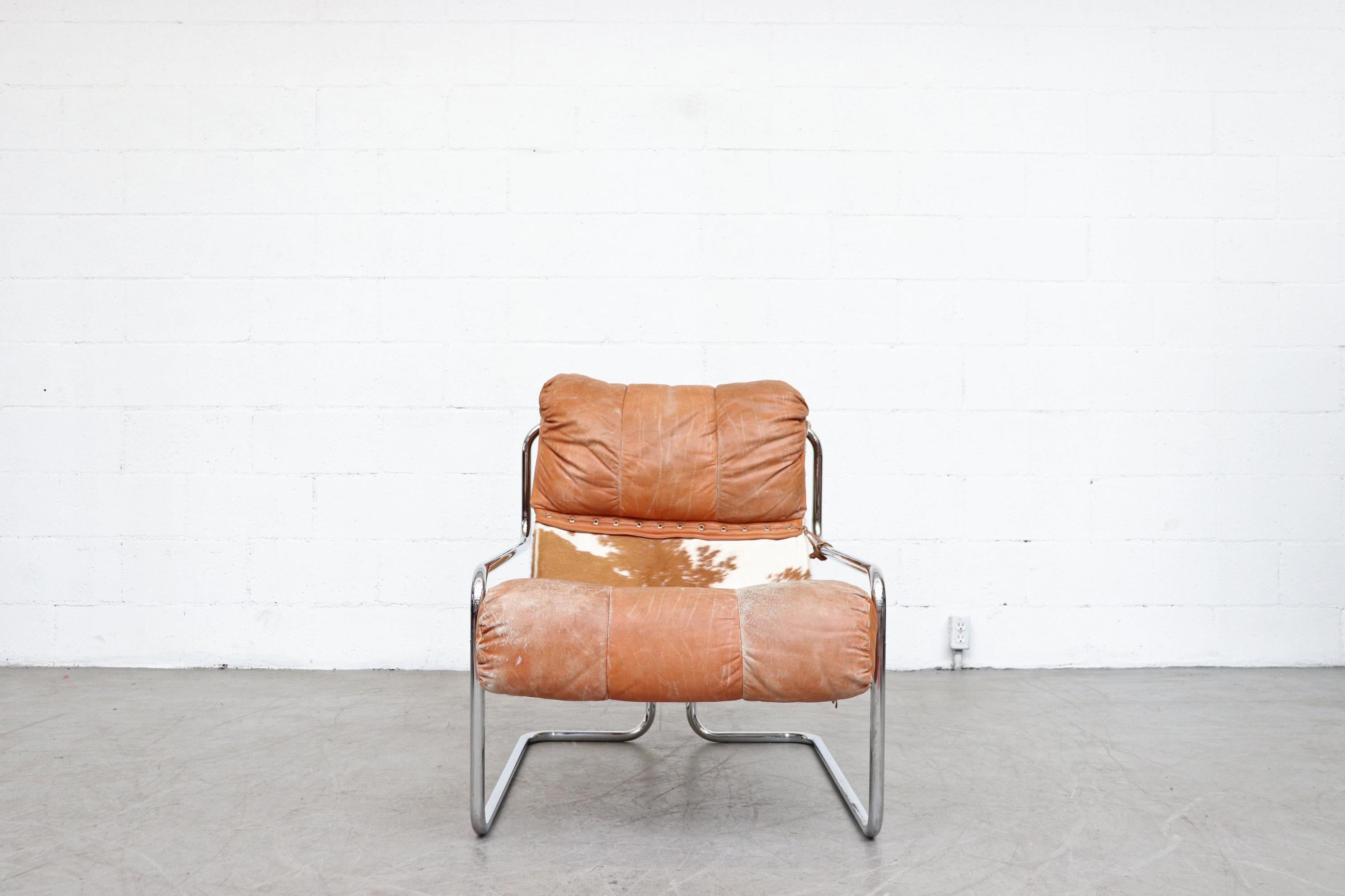 Guido Faleschini leather and cowhide lounge chair with tubular chrome frame. Leather in very used condition with visible wear. It is unknown if this is the original design or modified or a prototype. Color may vary slightly from photo.