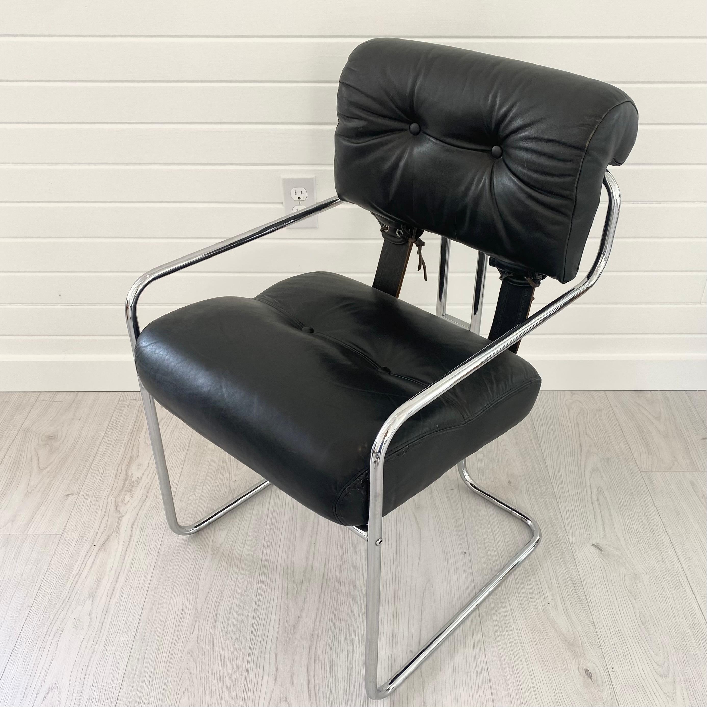 Handsome Tucroma chair designed by Guido Faleschini for Mariani/Pace. Sleek, original leather in black with the iconic chrome tube frame. Eyelets with leather strap closures secure the cushions to each other and to the frame. Great as a desk or side