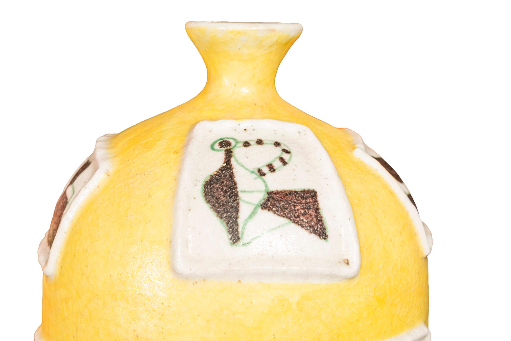 Guido Gambone (1909-1969), Bottle vase,
Enameled yellow ceramic, 
With cubist decoration,
Signed on the bottom,
Italy, circa 1950.

Measures: Height 46 cm, diameter 18 cm.

Guido Gambone (1909 – 1969) is one of the most important and influential