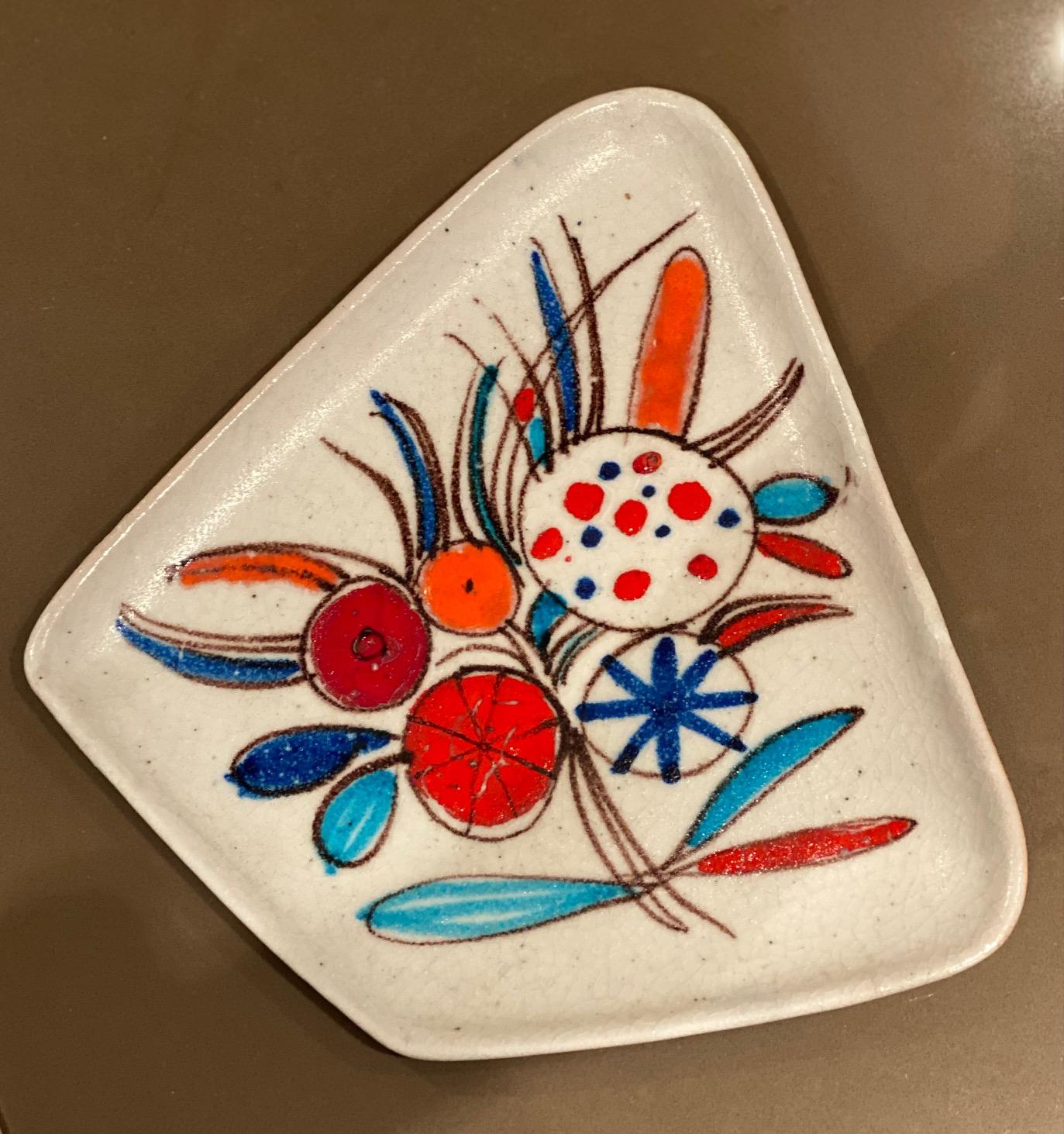Guido Gambone (1909-1969)
Hand painted enameled flowers decor on white glazed ceramic.
Signed Gambone, Italy with donkey mark.
Guido Gambone was one of the best known leaders of the Italian midcentury modernist ceramics movement.
 