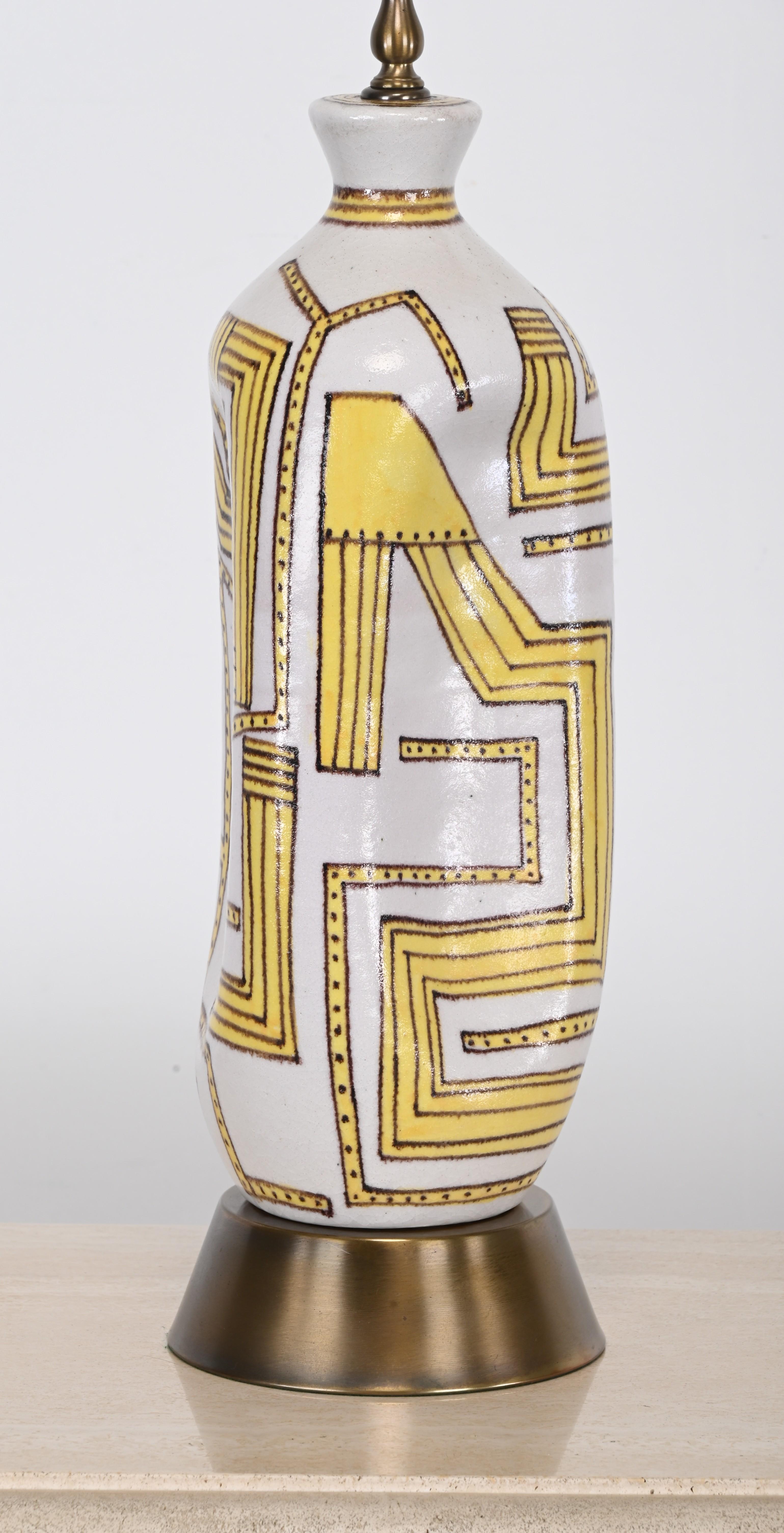 A monumental 19-inch ceramic table lamp with a geometric yellow and white design. This impressive lamp is signed 
