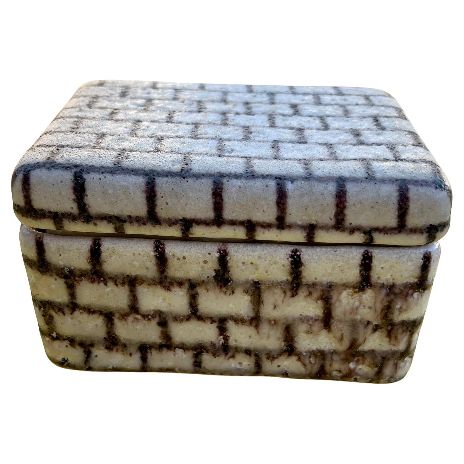 Foamy glazed lidded ceramic box with grid design created by Guido Gambone, circa 1950s.  Box measures 3.5