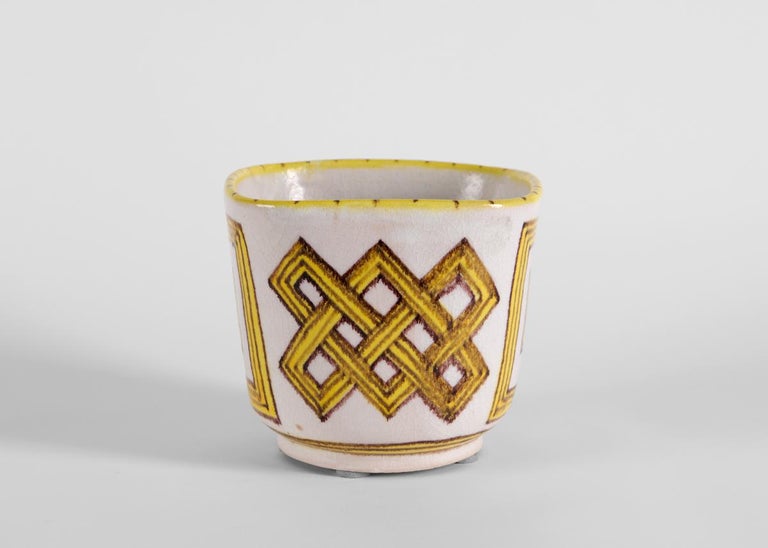 These sunny vases feature rectilinear and interlocking patterns in yellow around the body and a dotted yellow rim.

Signed in ink: Gambone / Italy.