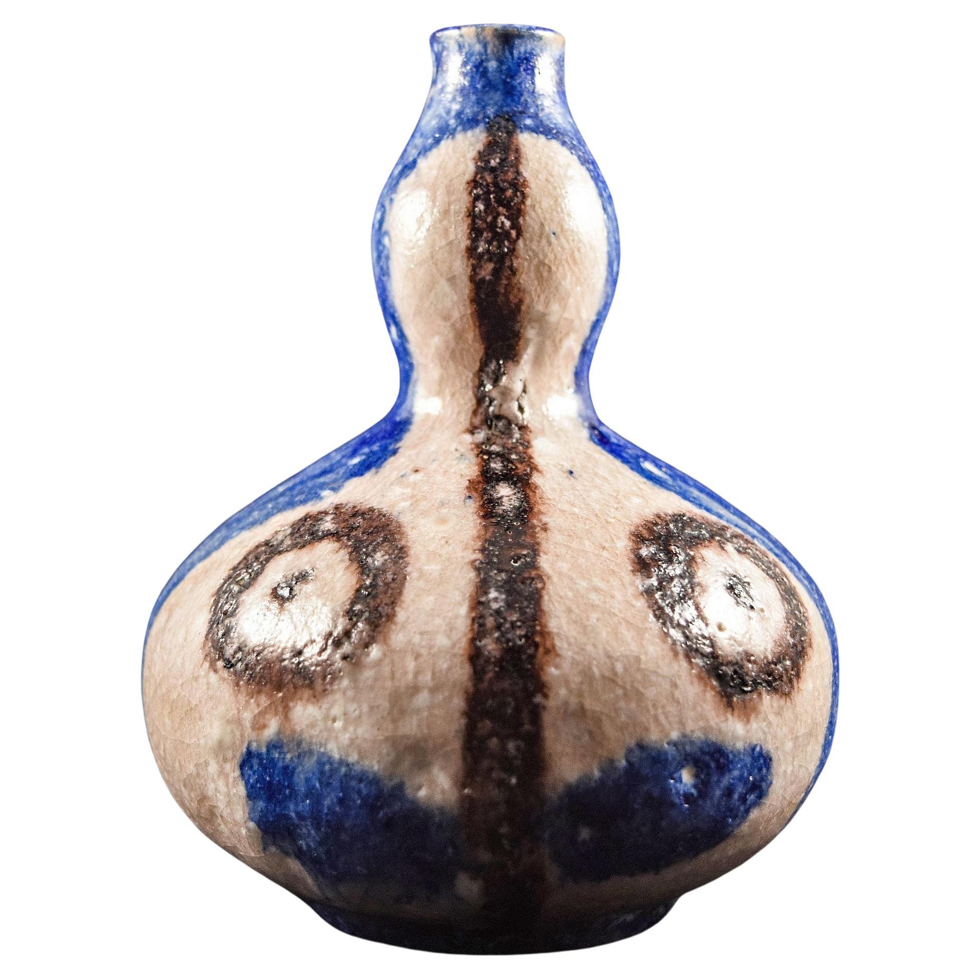 Vase ovoïde à col noué peint d'un visage géométrique de Guido Gambone