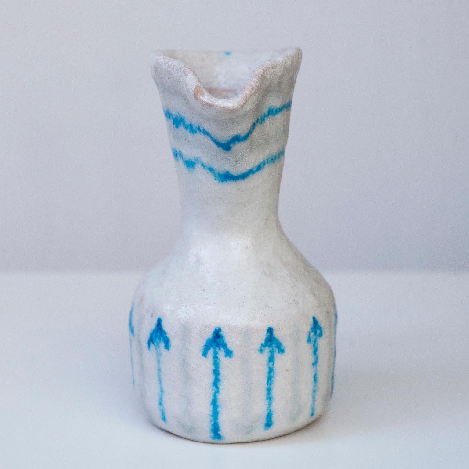 Fabulous ceramic pitcher by Guido Gambone with white and green glaze.

Signed on the bottom with the donkey mark. 
Guido Gambone (1909–1969) is one of the most important and influential Italian ceramic artist in the mid 20th century- He was born