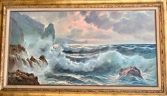 Southern Italian Coastal sea scene, waves crashing onto rocks, with sunsetting