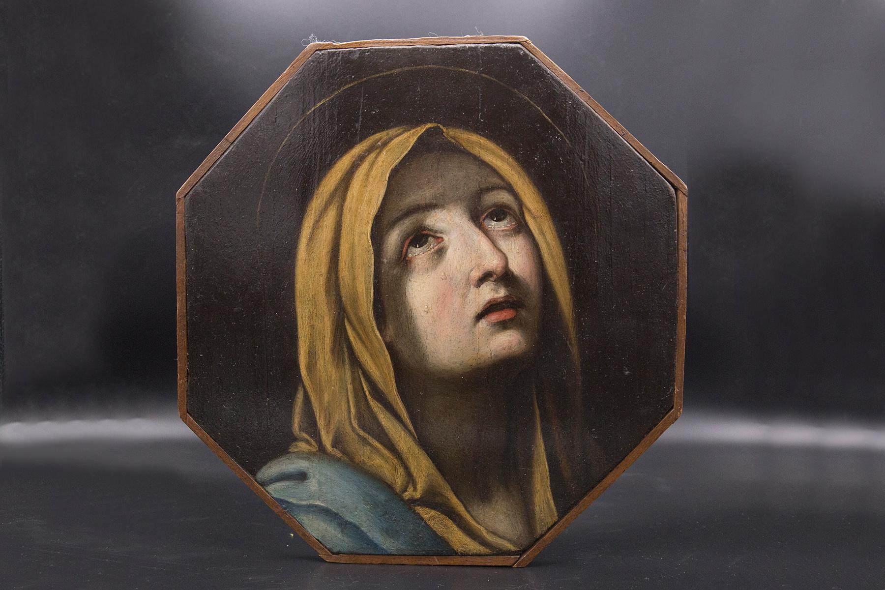 Magnificent 17th century panel painting by Guido Reni, fine Italian manufacture.
The painting was made on a hexagonal wooden panel, the frame of which is visible.
The painting is a classic Christian painting: it depicts the Madonna Addolarata,