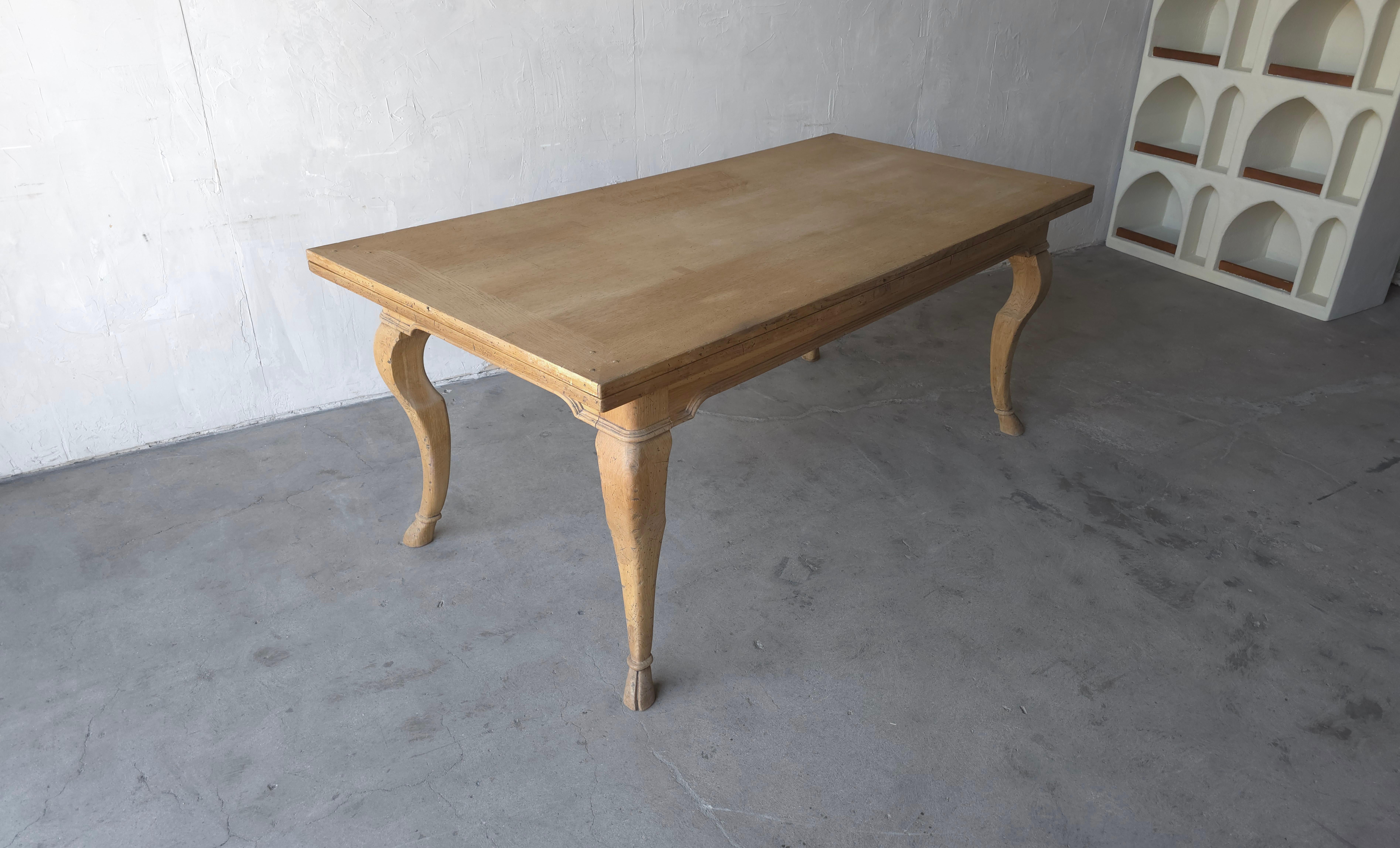 An amazing artisanal draw leaf, extension dining table made in Italy by Guido Zichele for Bloomingdales.  The table has a very French Country, Rustic European, old world farmhouse refectory style.  Constructed of beautiful white washed oak with a