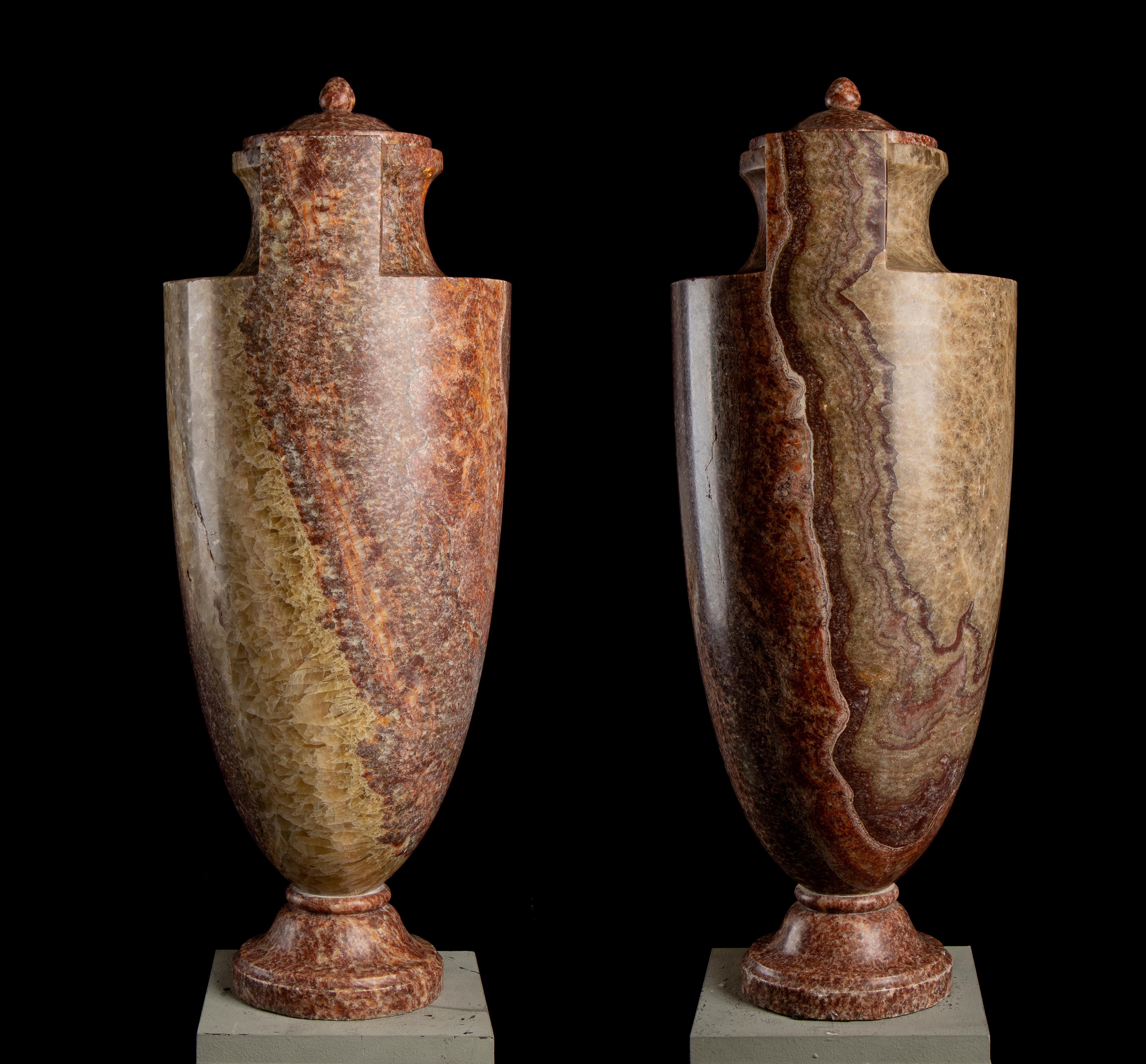 Antoine Guillarme GrandJacquet Important Pair of decorative lidded vases made in Alabastro Marino. Above a round hood-like base, the body in an elongated ovoid shape with a pair of folded handles developing from the vertical of the body, which
