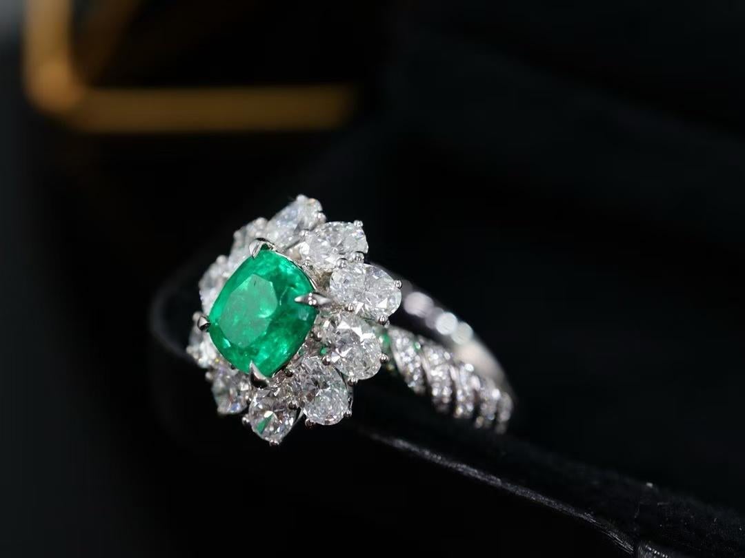 GUILD Certified 18K Flower Emerald Ring Thick Gold Inlay Full Diamonds

Main stone - 1.19 CT
Diamonds - 1.816 CT 
Total Weight - 4.75 GM

Certified Gemstone: Features a GUILD-certified emerald with vivid green color and good transparency.
Stunning