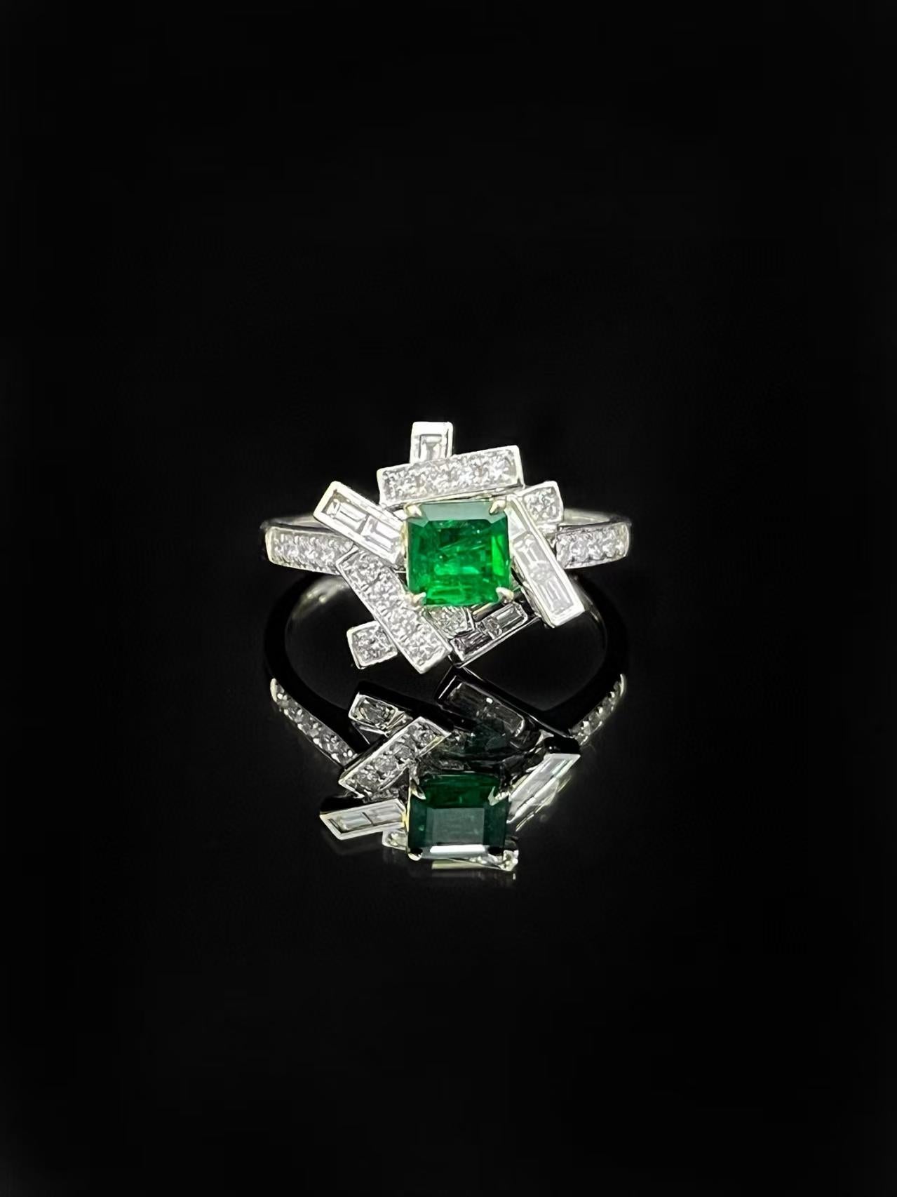 GUILD Certified 18K White Gold Emerald and Geometric Interlaced Diamonds Ring

Main stone E - 0.50 CT
Side Stone D - 0.51 CT 
Total Weight - 3.26 GM

Certified Gemstone: Comes with a GUILD certificate. The central emerald features a vivid green