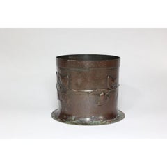 Guild of Handicraft style of. An Arts & Crafts copper plant pot with two florets