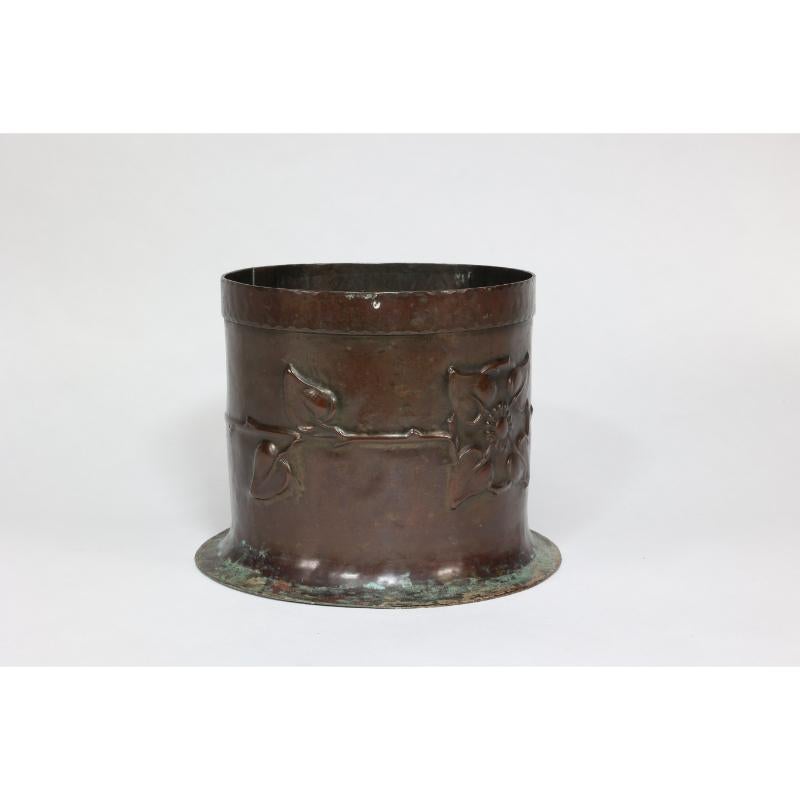 Arts and Crafts Guild of Handicraft style of. An Arts & Crafts copper plant pot with two florets For Sale