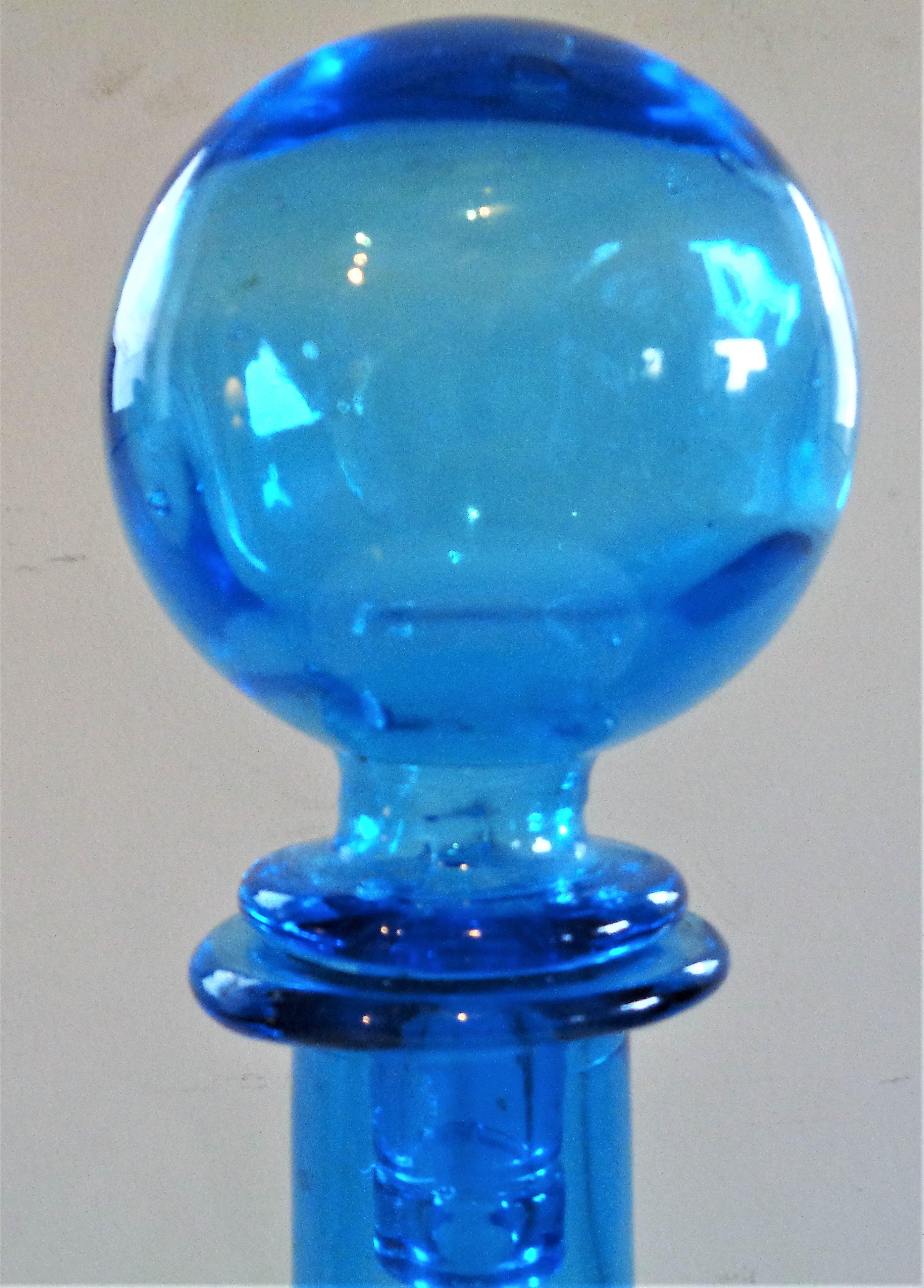 Tall Italian glass bottle with original silver foil label - Guildcraft, Hand Made, Italy. Beautiful blue color w/ large ball stopper and great sculptural form. Circa 1960's. Look at all pictures and read condition report in comment section.