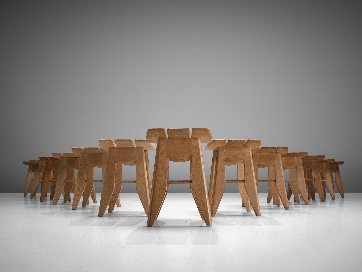 Guillerme et Chambron, 13 stools, solid oak, France, 1960s.

Thirteen tabourets in oak by French designer duo Guillerme and Chambron. These stools have a sculptural, Japanese appearance. The top is made of three slats, the two on the outside are