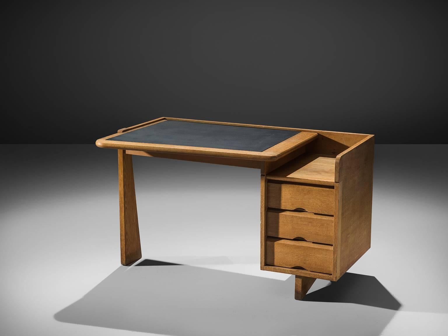 Guillerme et Chambron, desk, oak, by France, 1960s. 

This small desk is designed by the French designer duo Guillerme and Chambron. This writing desk holds the characteristic decorations and lines of this duo such as the decorative handles at the