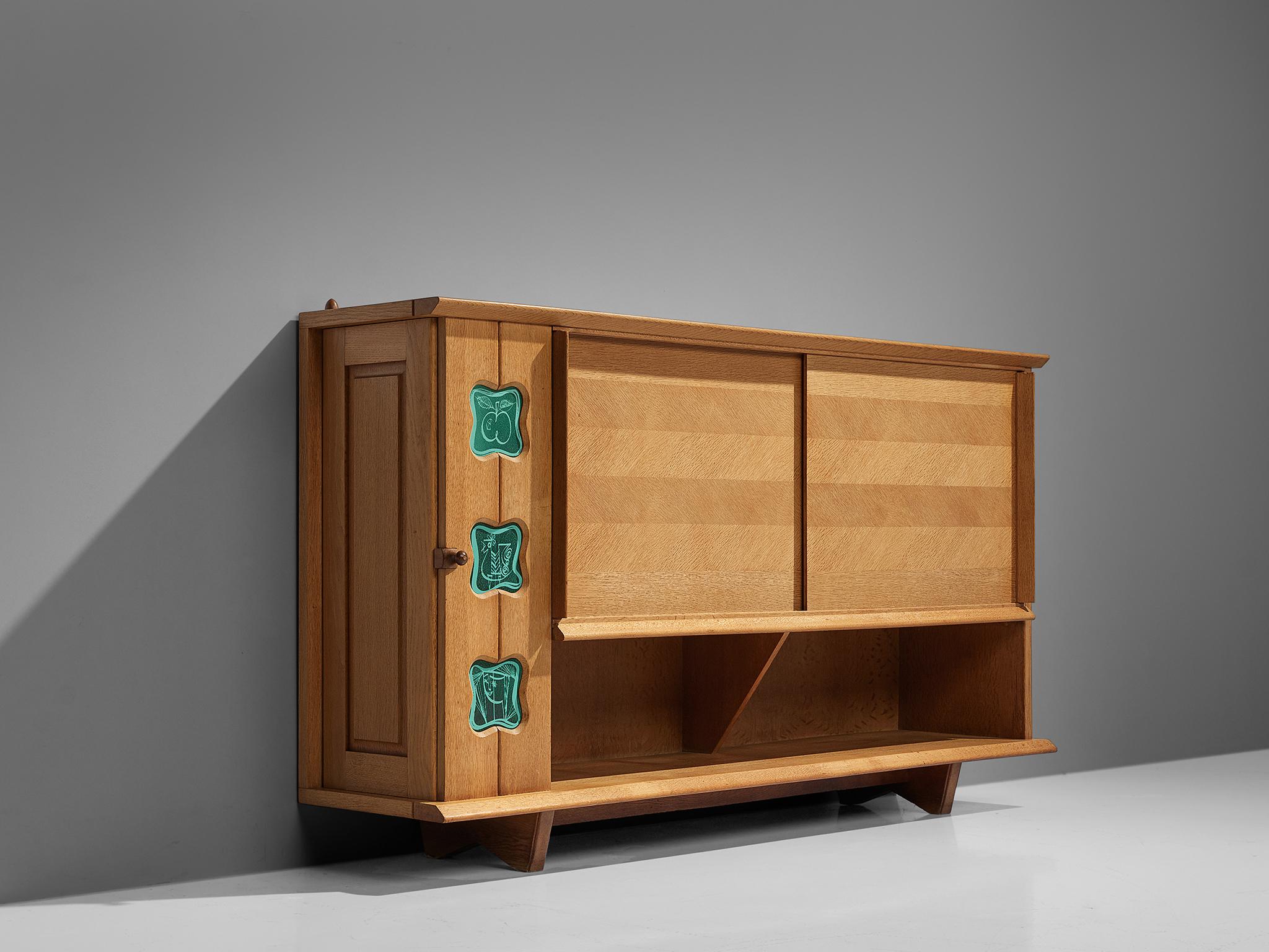 Guillerme et Chambron for Votre Maison, high sideboard, solid oak, France, 1960s,

This characteristic cabinet in solid oak is designed by the French designer duo Jacques Chambron (1914-2001) and Robert Guillerme, (1913-1990). It features two