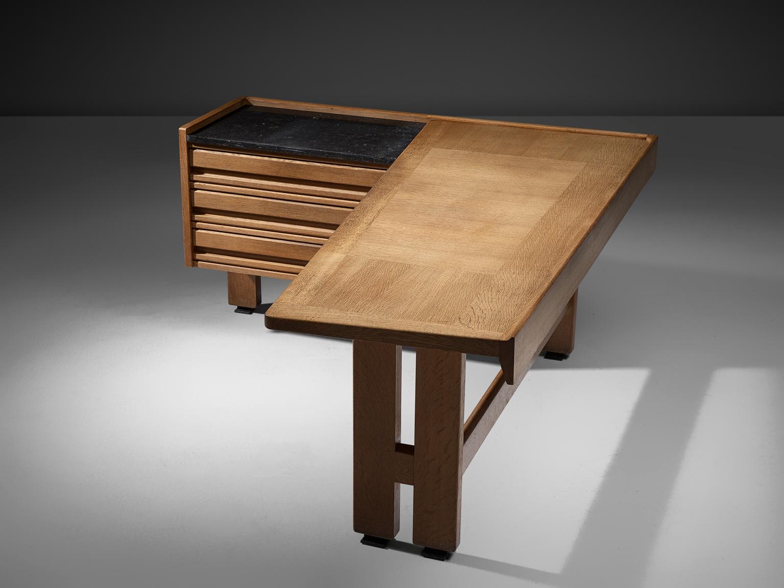 Guillerme et Chambron, desk, oak and granite, by France, 1960s. 

Corner desk by French designer duo Guillerme and Chambron. This executive desk holds the characteristic decorations and lines of this designer duo. The top is inlaid with wood in