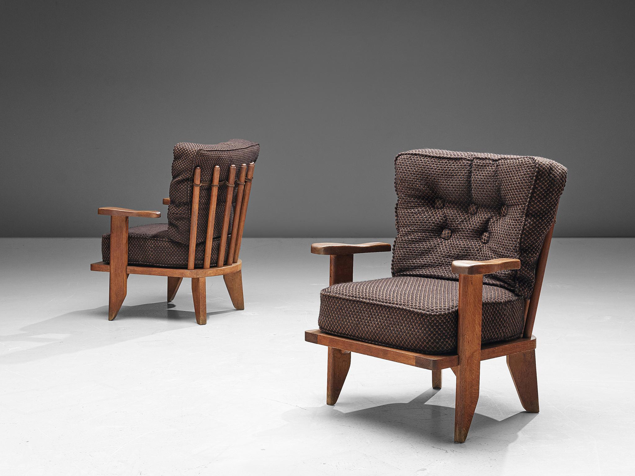 Robert Guillerme & Hervé Chambron for Votre Maison, armchairs, in walnut and fabric upholstery, France, 1960s.

Characteristic lounge chairs by French designer duo Guillerme and Chambron. With the typical spindle back, these easy chairs have a