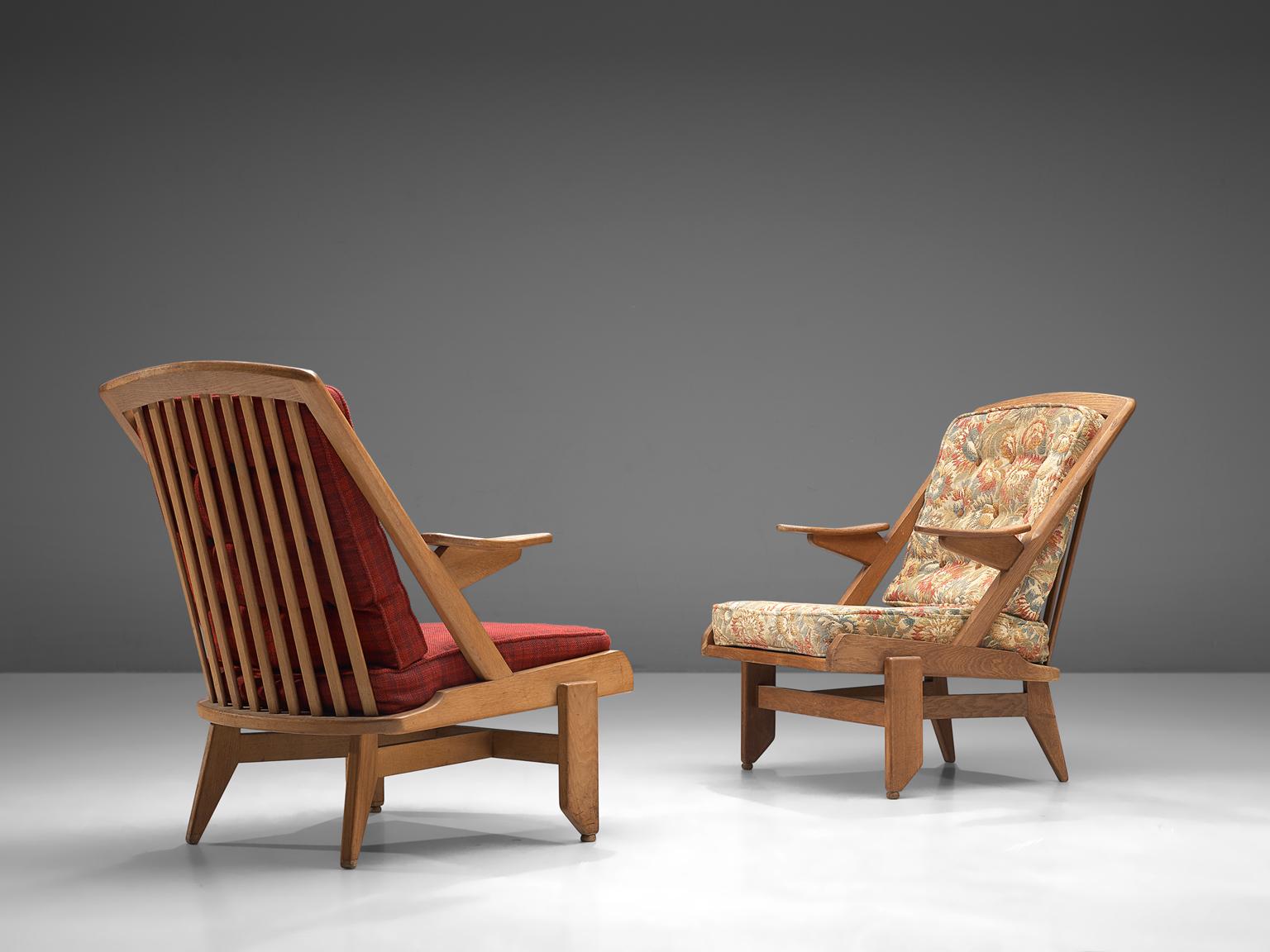 Guillerme and Chambron, two lounge chairs, green checkered fabric and oak, France, 1950s. 

This French designer duo is known for their extreme high quality solid oak furniture, from which this lounge chair is another great example. This chair has