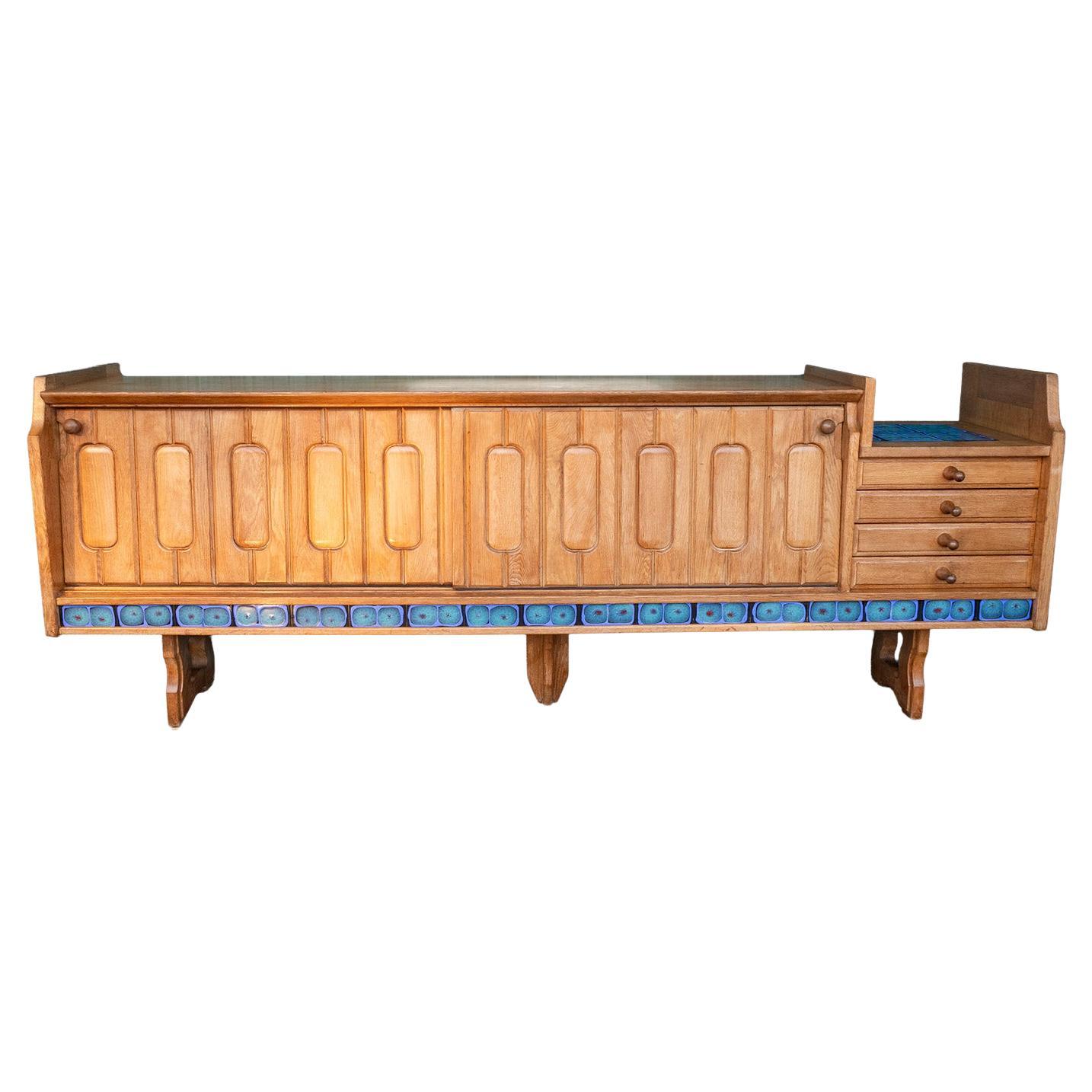 Guillerme and Chambron. Sideboard in light oak and ceramic. Circa 1960. For Sale