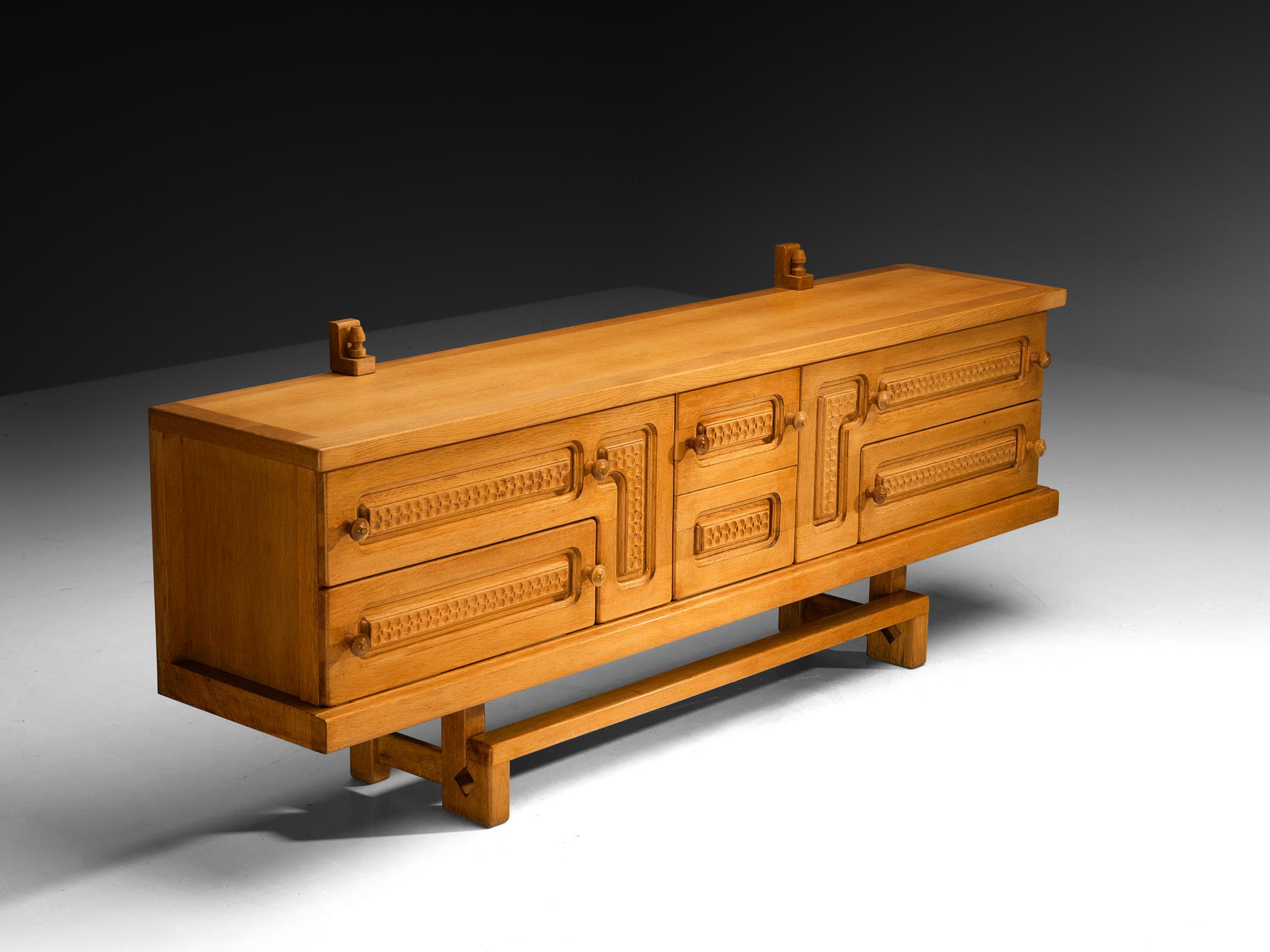 Guillerme et Chambron for Votre Maison, sideboard or credenza, oak, glass, France, 1960s

This exceptional sideboard is a great example where both aesthetics and functionality come into play; elegant in line and practical to use for various