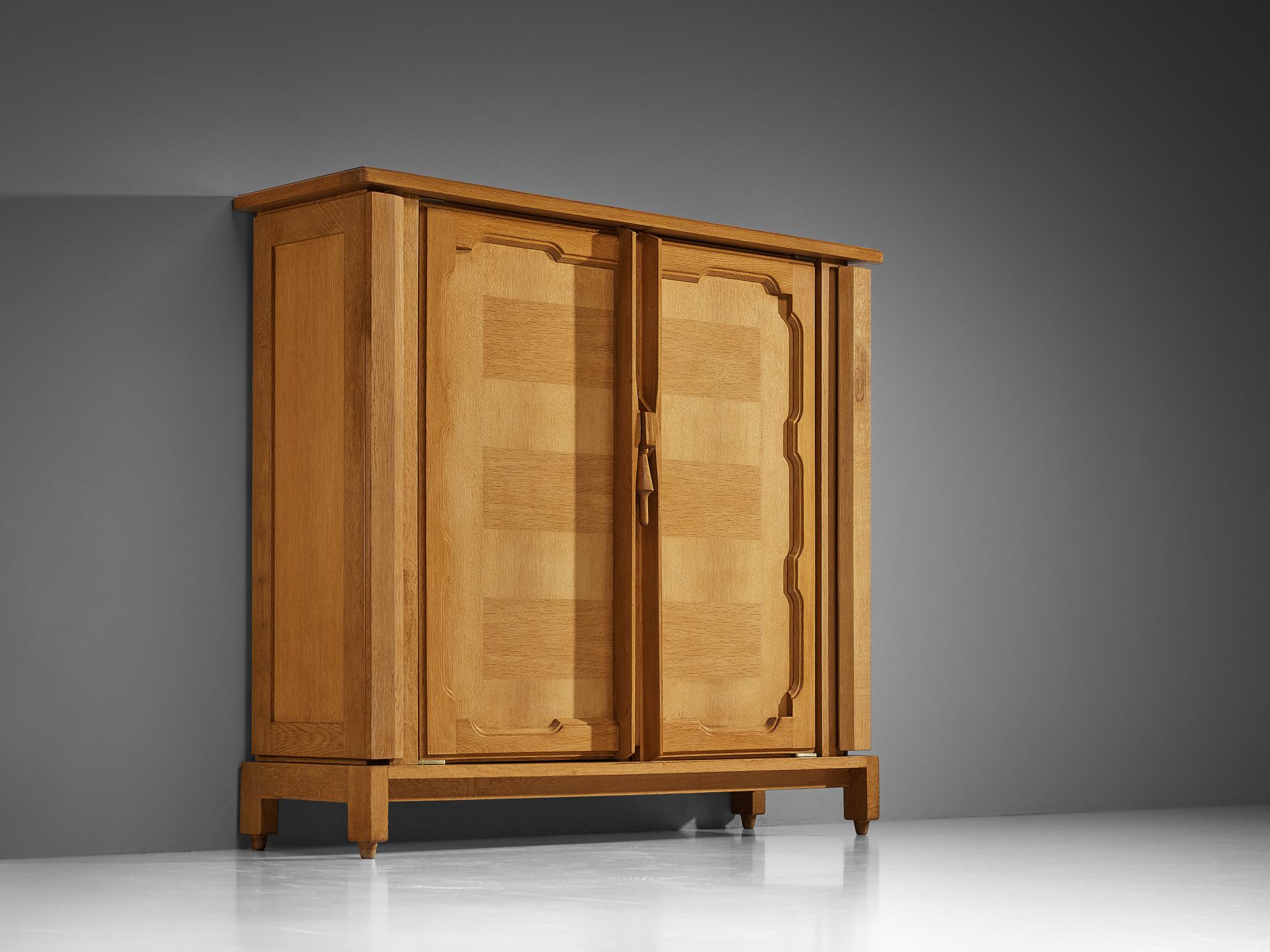 Guillerme et Chambron for Votre Maison, 'Bouvine' cabinet, oak, France, 1960s


Step into timeless elegance with this meticulously crafted case piece designed by the renowned artisans Guillerme and Chambron. Adorned with exquisite attention to
